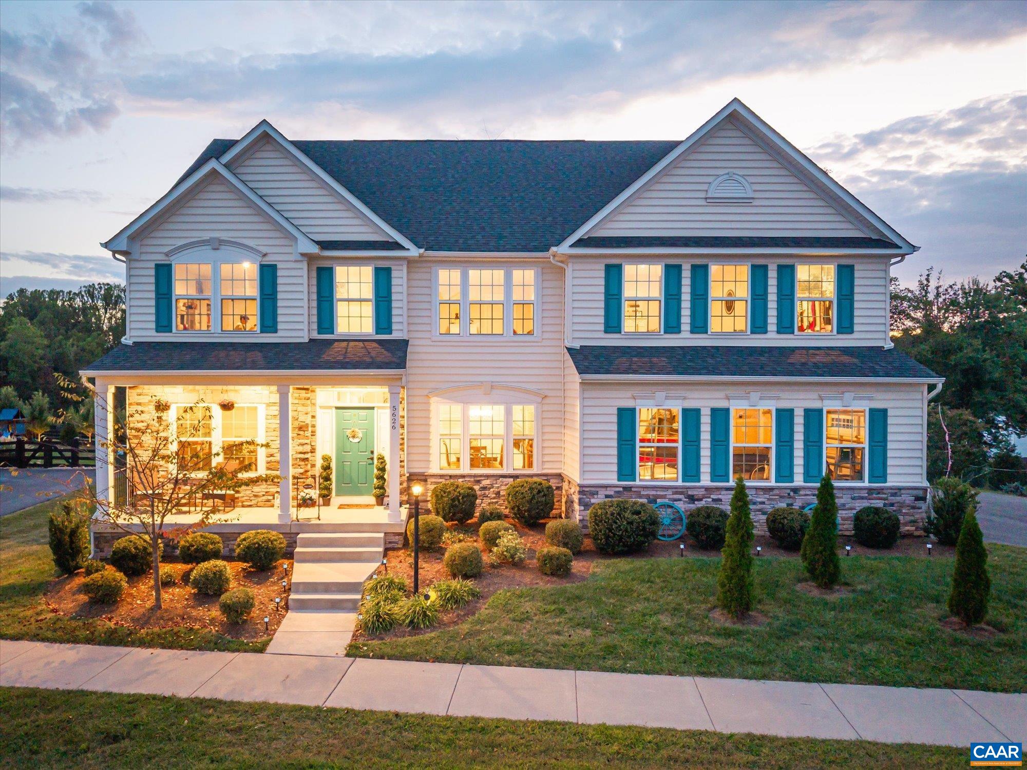 Set on a half-acre lot in Sparrow Hill, this 6-bedroom, 6.5-bath home offers over 5,600 finished square feet just minutes from Crozet and Charlottesville.  The open floor plan is anchored by a gourmet kitchen with oversized island, quartz countertops, mosaic tile backsplash, dual ovens, and gas cooktop with stainless hood. A spacious mudroom with built-ins connects to the two-car garage. Upstairs, find five bedrooms, including a luxurious owner’s suite with tray ceiling, sitting area, two walk-in closets, and spa-like bath with a two-person Roman shower.   The finished basement adds a large recreation room plus a rare indoor-outdoor hot tub room, perfect for year-round use. Wide porches and landscaped outdoor spaces complete the picture. All this within minutes of Crozet’s shops, dining, and top wineries and breweries—King Family, Pro Re Nata, Septenary, and Chiles Peach Orchard.