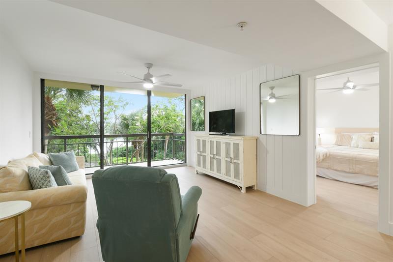 Live the dream of waterfront living in this fully renovated 2 bed, 2 bath condo with 1,400 sq. ft. of elegant, light-filled space and sweeping Intracoastal views from nearly every room. Just 1 mile from the beach, this renovation completed in 2025 features modern finishes, stylish flooring, and an open-concept layout designed for comfort and flow. A versatile bonus room off the laundry offers flexibility for a home office, guest space, or cozy retreat. Expansive windows frame the water throughout, filling the home with natural light and coastal charm. Perfect for entertaining or quiet evenings in, this condo blends sophistication with relaxationa''where sunsets, sea breezes, and marina views greet you daily.