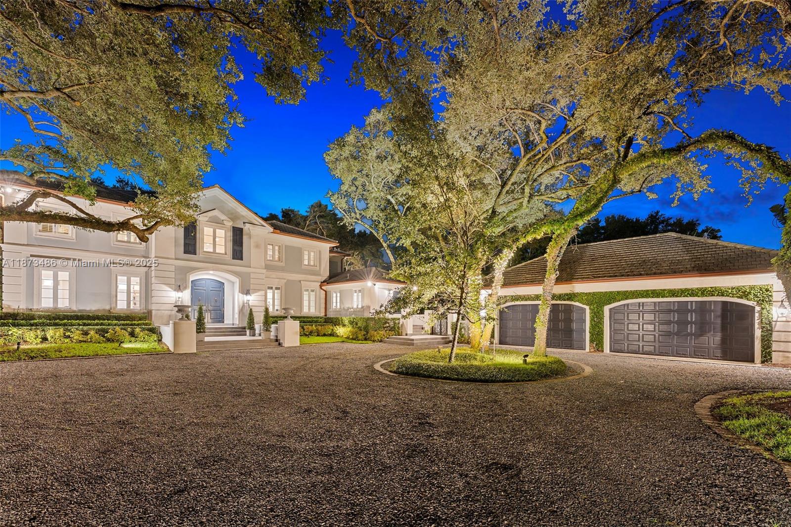 Stately Neoclassical-inspired residence on a cul-de-sac in the gated enclave of Banyan Drive. Towering oaks frame the property, evoking timeless European elegance & serene bond with nature. Ideally located within walking distance of West Matheson Park. Inside, a walnut-floored foyer opens to light-filled living spaces. Chef's kitchen boasts Wolf 6-burner gas range, Miele ovens, coffee system, dishwasher, plus Sub-Zero refrigeration, ice maker, & wine cooler - renovated in 2019 along with the family room. Features include intricate millwork, walnut & marble floors, downstairs suite & office, expansive terrace, & whole-house generator. Impact windows/doors (2019), 4 newer AC units, & oversized laundry offer peace of mind. Upstairs: 4 en-suite bedrooms plus a flex room for a playroom or gym.