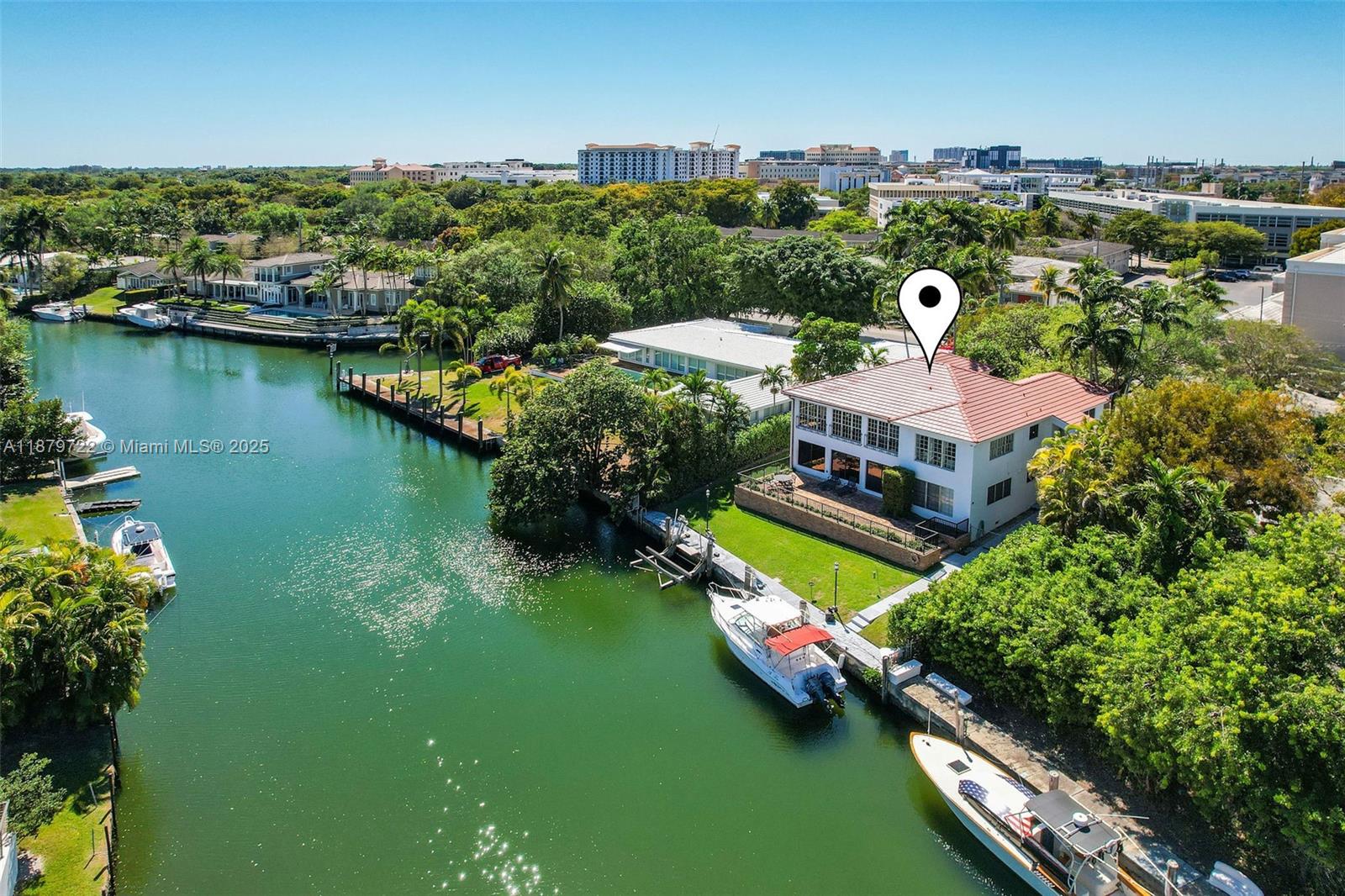 Unique waterfront opportunity! Two folios (03-41-30-016-0061 & 03-41-30-016-0062) combine to create a 4,072 SF property with an 80’ dock and just three fixed bridges to Biscayne Bay—a true boater’s paradise. Currently zoned as condominium, the property is offered as one sale. Each residence features 2BR/2.5BA, kitchen, family room, dining and living rooms, sunroom, ensuite bedrooms, exceptional interior storage, laundry room, exterior storage, and 3 parking spaces. Recent updates include a 2025 roof and renovations in neutral tones. With the proper governmental approvals, the property may present potential for conversion into a single-family home. Upstairs unit currently rented. Please do not disturb the tenants. Easy to show.