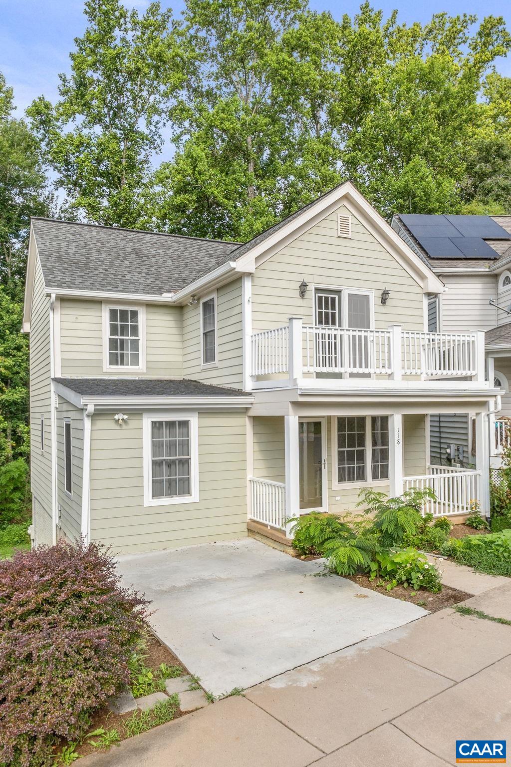 New price!  Minutes to Downtown and UVA, this cul-de-sac home offers privacy with wooded views.  Built in 2006 with a thoughtful addition, it features wood floors on two levels, beautifully renovated baths, and a primary suite with spa bath + private balcony.  A large deck, finished basement with full bath, and ample storage complete the package.