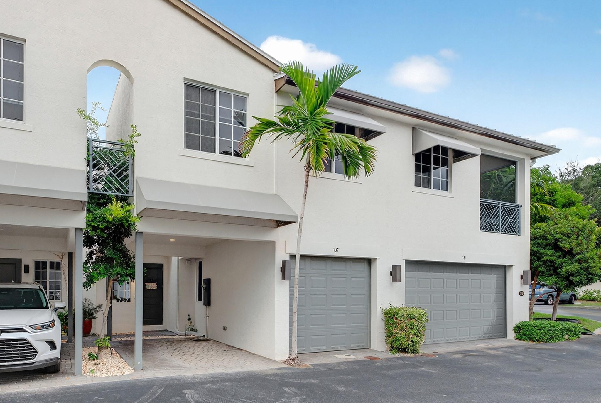 Step into modern sophistication in this 3BR/2.5 BTH built 2019–20 in gated Atlantic East, a BOUTIQUE COMMUNITY with HEATED POOL & CLUBHOUSE, MINUTES TO BEACH. Dramatic soaring ceilings, expansive windows & polished white porcelain tile enhance the MODERN OPEN GREAT ROOM, flowing into the kitchen featuring CHIC QUARTZ COUNTERS & STAINESS APPLIANCES, overlooking the PRIVATE COURTYARD. Upstairs handsome wood laminate leads to a luxe PRIMARY SUITE W. SPA-STYLE BATH offering dual vanities, soaking tub, frameless shower, plus DUAL WALK-INS. Two add’l bdrms, expansive guest bath with dual sinks, and a dramatic loft view complete the 2nd level. IMPACT WNDWS/DRS, SMART WIRING, PRIVATE GARAGE + CARPORT. Near PB's new OLD TOWN UNTAPPED Cultural Arts & Music Block Party. See Matterport Tour attached. Step into modern sophistication in this 3 bedroom, 2.5 bath townhome, built in 2019–20 in the gated community of Atlantic East. Inside, dramatic soaring ceilings and expansive windows flood the home with natural light, while clean architectural lines feel like modern art. This residence isn’t just a place to live, it’s a statement. Part of the coveted newer phase of this intimate community of only 44 homes, Atlantic East offers a pool, clubhouse, and a lifestyle just minutes from the ocean.

The interior is as stylish as it is functional. The great room draws you in with its sense of volume and light, flowing effortlessly to a sleek kitchen finished in quartz and stainless steel. The first level is wrapped in polished white porcelain tile, creating a seamless, light-reflective surface that enhances the open design. This finish not only amplifies natural light but also delivers durability and easy maintenance, perfect for modern coastal living. Even the private courtyard feels like a curated extension of the home.

Upstairs, rich wood-look laminate flooring leads to a primary suite designed for indulgence, with a spa-inspired bath featuring premium finishes, a deep soaking tub, frameless glass shower, dual vanities, and not one but two walk-in closets. A second full bath with dual sinks and frameless shower complements two additional bedrooms, while a dramatic loft overlook completes the space.

With a private garage, additional carport, and thoughtful details throughout, this home embodies modern living with a coastal soul, wrapped in architectural drama and everyday comfort.