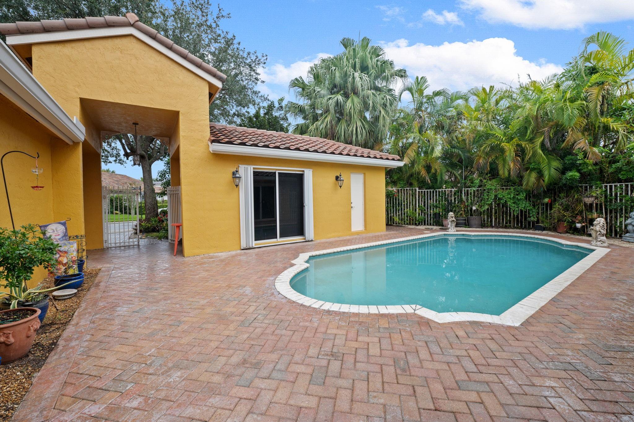 Courtyard pool looking at guesthouse/in-law quarters and front entrance
