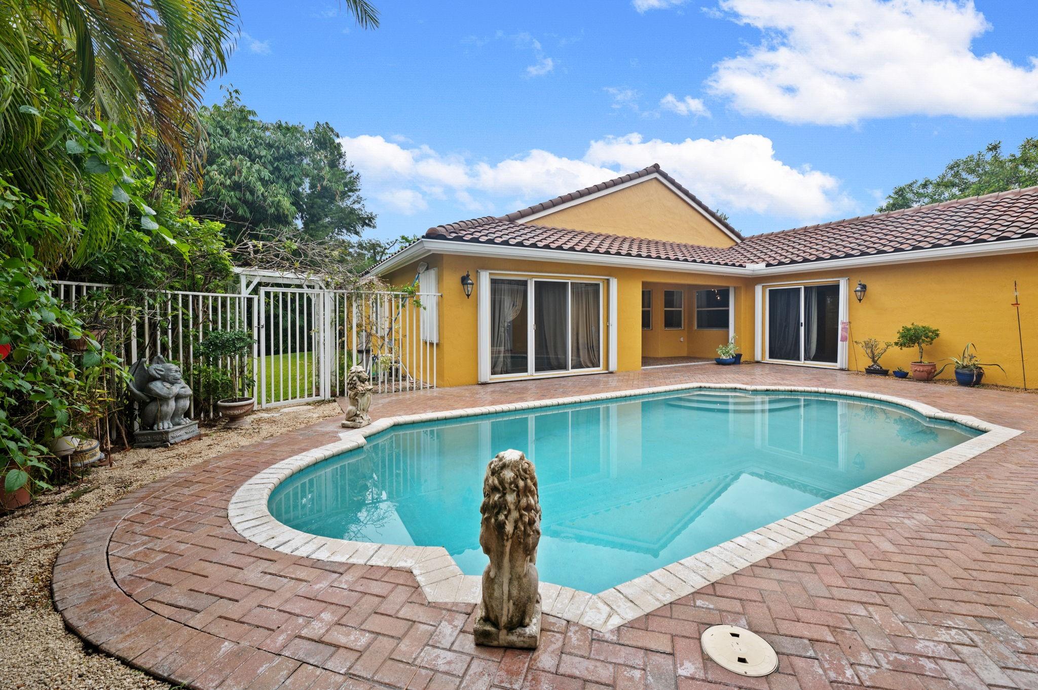 Courtyard pool looking at main house and side yard