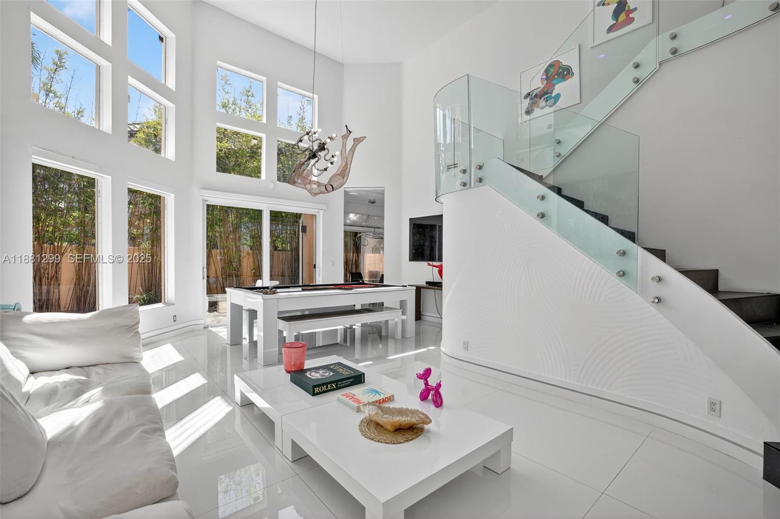 WOW! NEW NEW NEW! THIS MODERN DREAM HOME WAS 100% RENOVATED TO PERFECTION WITH NO EXPENSE SPARED. ALMOST $1M SPENT ON THE FINEST FINISHES THAT INCLUDE MIA CUCINA STATE OF THE ART GOURMET KITCHEN OPEN TO FAMILY ROOM w/WOLF DOUBLE SUBZERO REFRIGERATOR/FREEZER, CONTEMPORARY GLASS STAIR RAIL, ALL NEW TOP OF THE LINE BATHROOMS, IMPACT GLASS WINDOWS w/ELECTRIC SHADES, SMART HOME CUSTOM LIGHTING & LUTRON LIGHTS, CUSTOM CLOSETS, CUSTOM DOORS, ALL STUNNING FLOORS, STRETCH CEILINGS, AND SO MUCH MORE! TWO STORY HIGH VOLUME CEILINGS WITH TONS OF WINDOWS AND LIGHT. POOL & DECK. AIR CONDITIONED 2 CAR GARAGE. AN EXQUISITE GEM!GATED COMMUNITY WITH COMMUNITY POOL/HOT TUB, KID'S PLAYGROUND, & ACCESS TO WATERWAYS MARINA, SHOPS, RESTAURANTS.