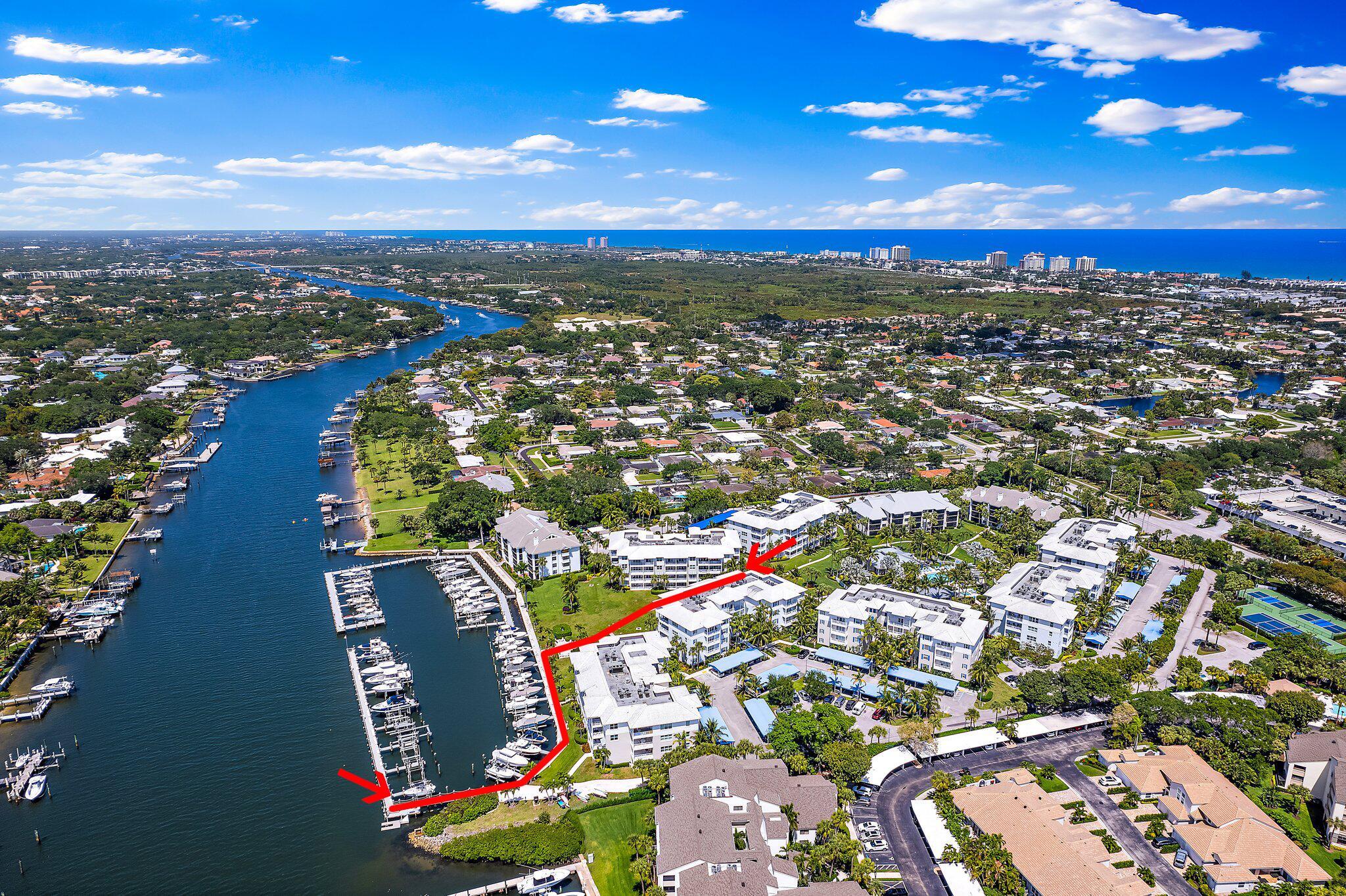 Bring your pets and your boat to this elegantly renovated first-floor residence at Bay Colony of Juno Beach. Built in 2014, this spacious condo boasts 9-foot ceilings, hurricane-impact glass, and an open-concept layout that flows effortlessly to a tranquil patio with gate access--ideal for pet owners. Included is a 40-ft boat slip with a 9,000 lb lift, a covered parking space very close to the building entrance, and a private storage unit. Enjoy resort-style amenities including a pool, fitness center, tennis and pickleball courts, BBQ grills, and a firepit. Two pets allowed, max of 26lbs.  The condo is available for purchase without the boat slip as well.
