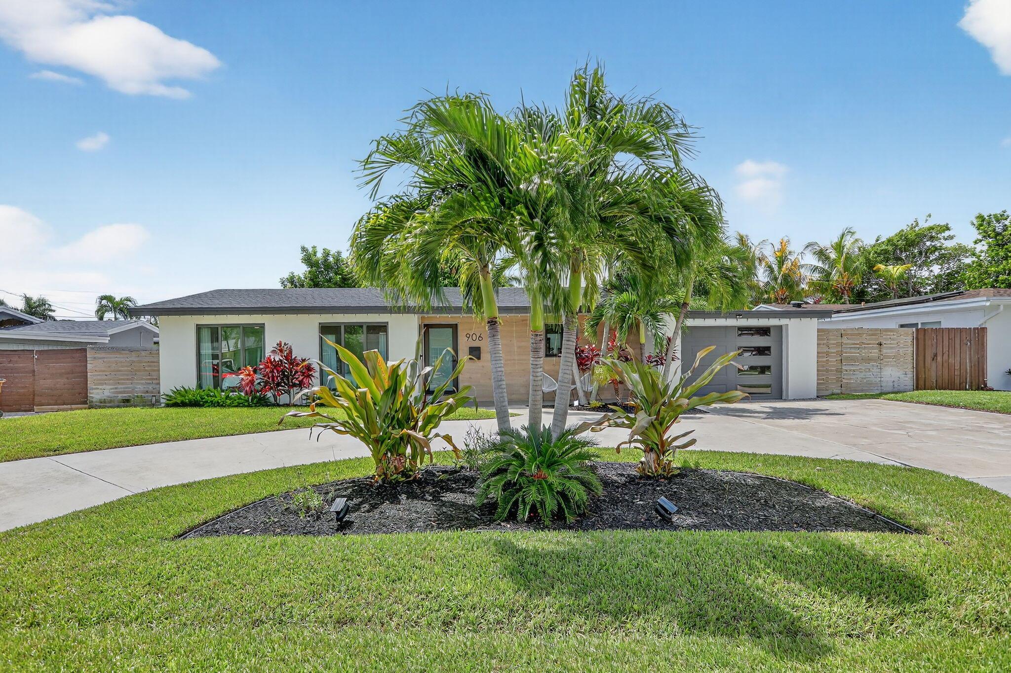 Experience this Stunning Fully Remodeled Pool Home in ''The Cove'', one of Deerfield Beach's most sought-after communities!  Modern coastal charm meets South Florida living in this fully remodeled pool home with a sleek curb appeal, lush tropical landscaping, and stylish updates inside and out, this residence is the perfect blend of comfort, elegance, and convenience just minutes from the Beach!This beautifully renovated 3-bedroom, 2-bathroom home with a 1-car garage features an open-concept floor plan designed for modern living. Morandi white polished porcelain tile flows throughout, while expansive ECO brand impact-glass sliders fill the home with natural light and create seamless indoor-outdoor living.  Stay worry-free during hurricane season with impact windows and doors as well as a Kohler 20KW full-house generator.  Enjoy spa-inspired bathrooms featuring sleek matte black fixtures, designer finishes, and so much more!"
The gourmet kitchen is a showpiece with Samsung stainless steel appliances, a striking Vittoria Black Leather Quartzite waterfall island, custom cabinetry, and a lunar white quartz backsplash. Spacious living and dining areas are accented by contemporary finishes, LED lighting, and bold design details. 
Step outside to your private backyard oasis with a newly diamond-brited pool, tiled pool deck, and ample green space within a fully fenced yard perfect for entertaining or relaxing in the Florida sun.
Located just minutes from the beach, vibrant restaurants, and boutique shopping, this home offers the ultimate South Florida lifestyle. Whether you're seeking a full-time residence or a high-performing short-term rental investment, this property is ready to impress.
Schedule your private showing today!