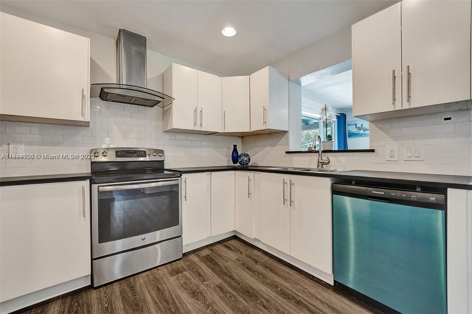 Modern kitchen with designer features at 3730 47th Ct - Home in Dania Beach