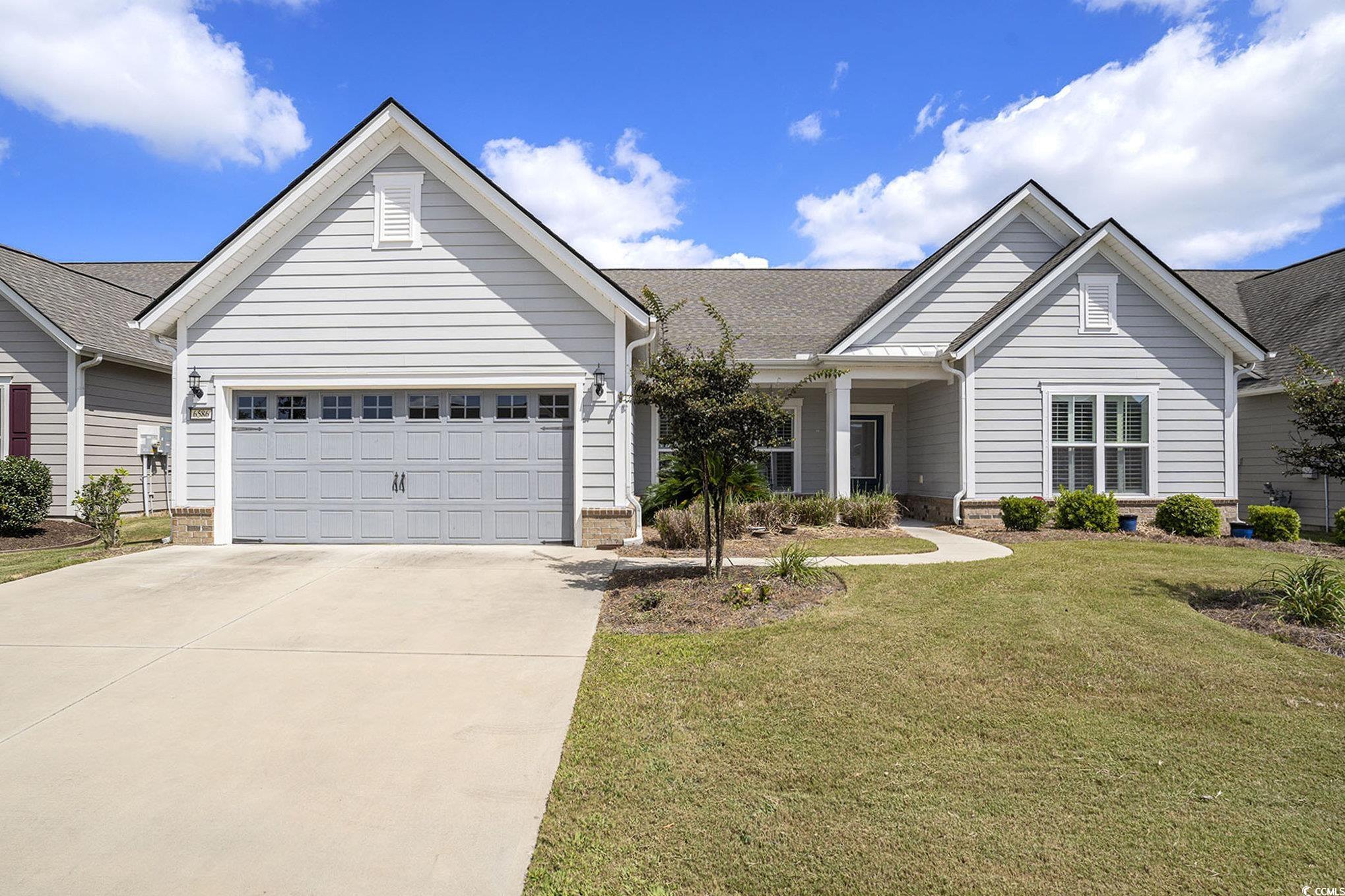 Welcome to 6586 Brindisi Street – Your Dream Home at the beach! Located in the heart of Myrtle Beach within the highly desirable Grande Dunes  Del Webb 55+ community, this meticulously maintained pond-side home is packed with premium upgrades and thoughtful design features throughout. Step inside to find elegant touches like wide baseboards, crown molding, wainscoting, custom shades at the sliding doors and plantation shutters and LVP flooring throughout the entire home.The floor plan includes a spacious gourmet kitchen with walk-in pantry,  a functional mudroom, a pass-through from the primary suite to the laundry room and a roomy two-car garage with additional storage.  Enjoy modern conveniences with a brand-new tankless water heater, built-in speakers, and a CPI security system for peace of mind.  The owner’s suite features a walk-in closet, ceiling fan, and a spa-like en-suite bath complete with dual sinks and a spacious beautifully tiled shower. Start your morning with coffee or wind down your day relaxing in your airy screened-in porch or outdoor patio while taking in the tranquil pond view. Enjoy low-maintenance living with HOA-covered lawn care and access to resort-style amenities, including: a beautifully appointed clubhouse, indoor and outdoor pools, hot tub, fitness center, tennis & pickleball courts, private beach club with ocean front swimming and dining, a vibrant calendar of social events, and walking and bike paths throughout throughout the neighborhood and along the intracoastal waterway. Just minutes from top-rated restaurants, shopping, and healthcare facilities, Del Webb at Myrtle Beach offers not just a home—but a lifestyle. Don’t miss your opportunity to live in one of the area’s most sought-after communities. Schedule your private showing today!