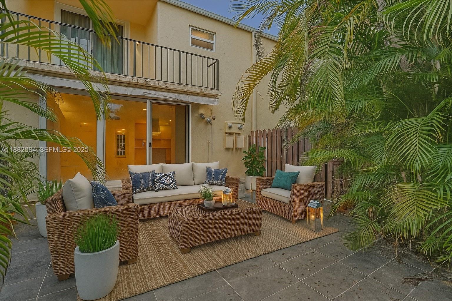 Discover the potential of this 2/2.5 townhome in the desirable Three Islands Venetian West Community. Meticulously maintained, key updates: new roof (2024), impact windows & doors, new refrigerator, newer A/C, new flooring 2nd floor, freshly repainted, new window treatments, resurfaced front and back patios, new outdoor motorized awning. The spacious fenced backyard opens directly to Three Islands Park, playgrounds, basketball courts, and scenic walking trails.  Community amenities include a pool, tennis courts, and a clubhouse. Maintenance includes internet, cable, and water—seller pays off the remaining assessment in full. Ideally located minutes from beach, shopping, dining, and airports, this townhome is a rare blend of peace of mind and potential, ready for its next chapter with you!