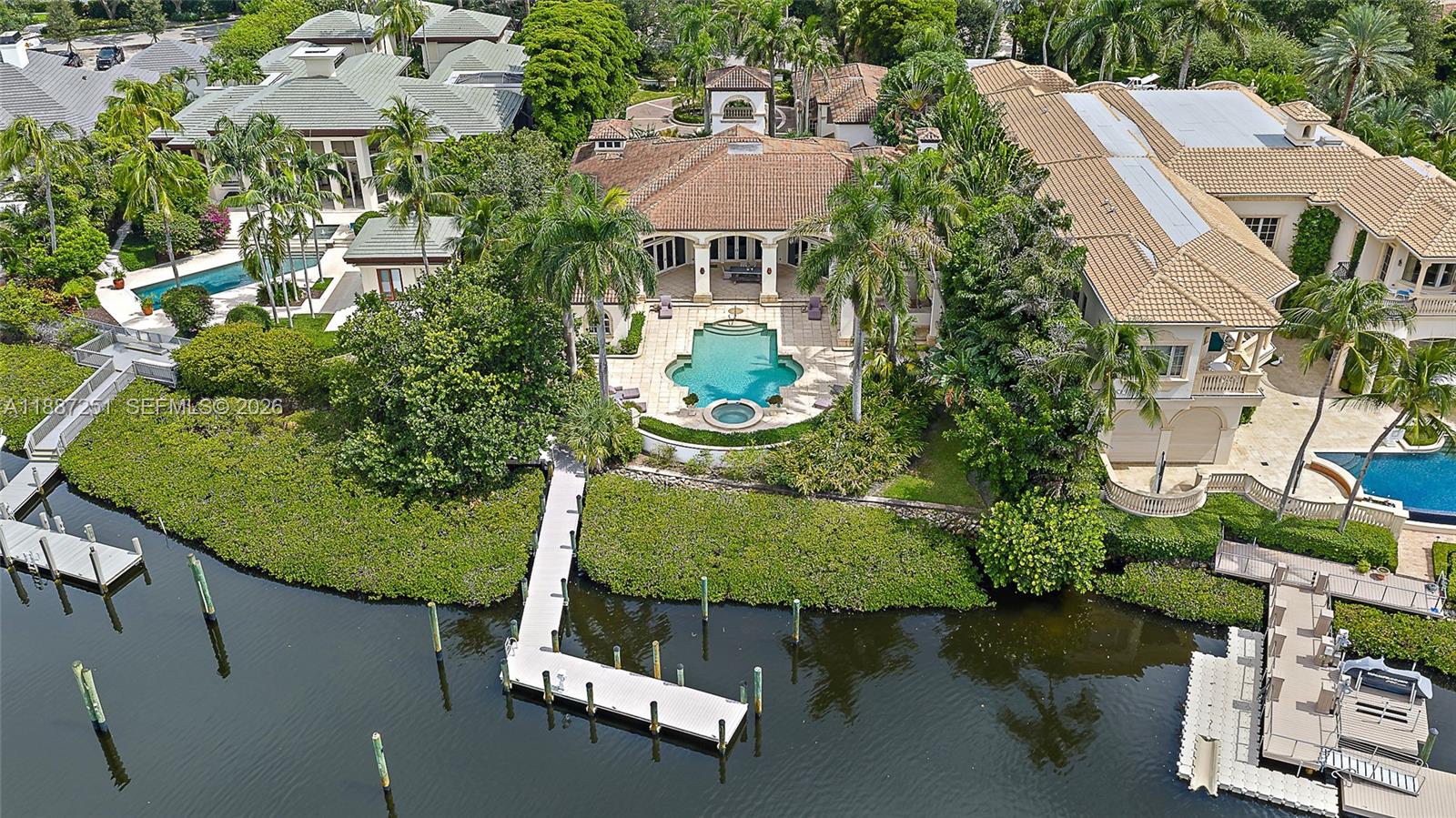 Experience waterfront living at its finest in this rare oversized estate property at 193 Spyglass Court in Admirals Cove. Situated on .66 acres, substantially larger than most lots in the community, this home offers uncommon space, privacy, and beautiful marina views. Located on a quiet cul-de-sac with no through traffic, it features a large estate-style driveway and thoughtful updates throughout, including a modernized kitchen & wine wall. Admirals Cove, recognized as a Platinum Club of America, is one of South Florida's premier private communities, offering a world-class marina with direct Intracoastal and ocean access, 45 holes of championship golf, tennis and pickleball, a full-service spa, multiple dining venues, and a resort-style clubhouse - delivering the ultimate waterfront life.