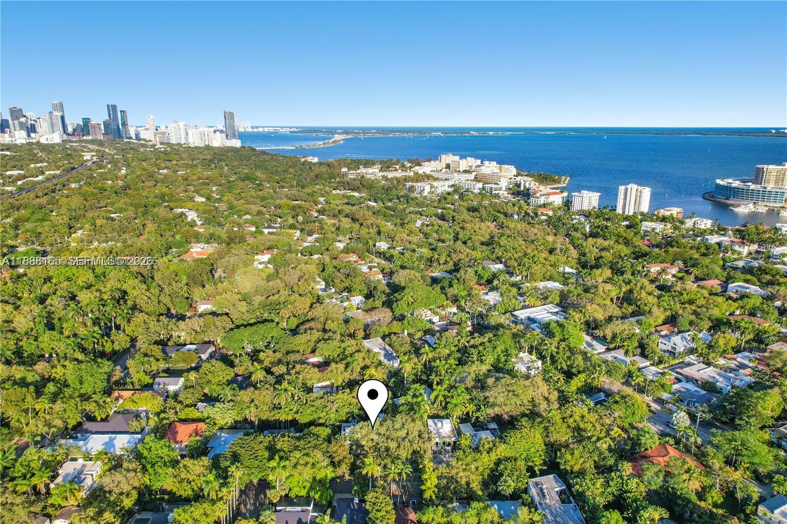 In the heart of a coveted North Coconut Grove street, is a finely crafted home on a 9000 sq ft lot. Built by and for a prominent South Florida Developer & his wife, no expense or detail was spared. This was not a “spec house” and it shows! Heated 40 ft lap pool, a sleek Italkraft kitchen, Bosch appliances, perfectly matched Calacatta marble, 4 ovens (including steam), wine cooler, French Oak floors throughout. The primary is a sanctuary with a spa-like bath. For late-night cravings, a “midnight bar” adds an extra touch of indulgence. Take the elevator to your rooftop terrace, ideal for alfresco dining. Walk/ bike to the Village & Biscayne Bay. Minutes to Brickell, the airport, major shopping, Key Biscayne beaches. Luxury, convenience, natural beauty.