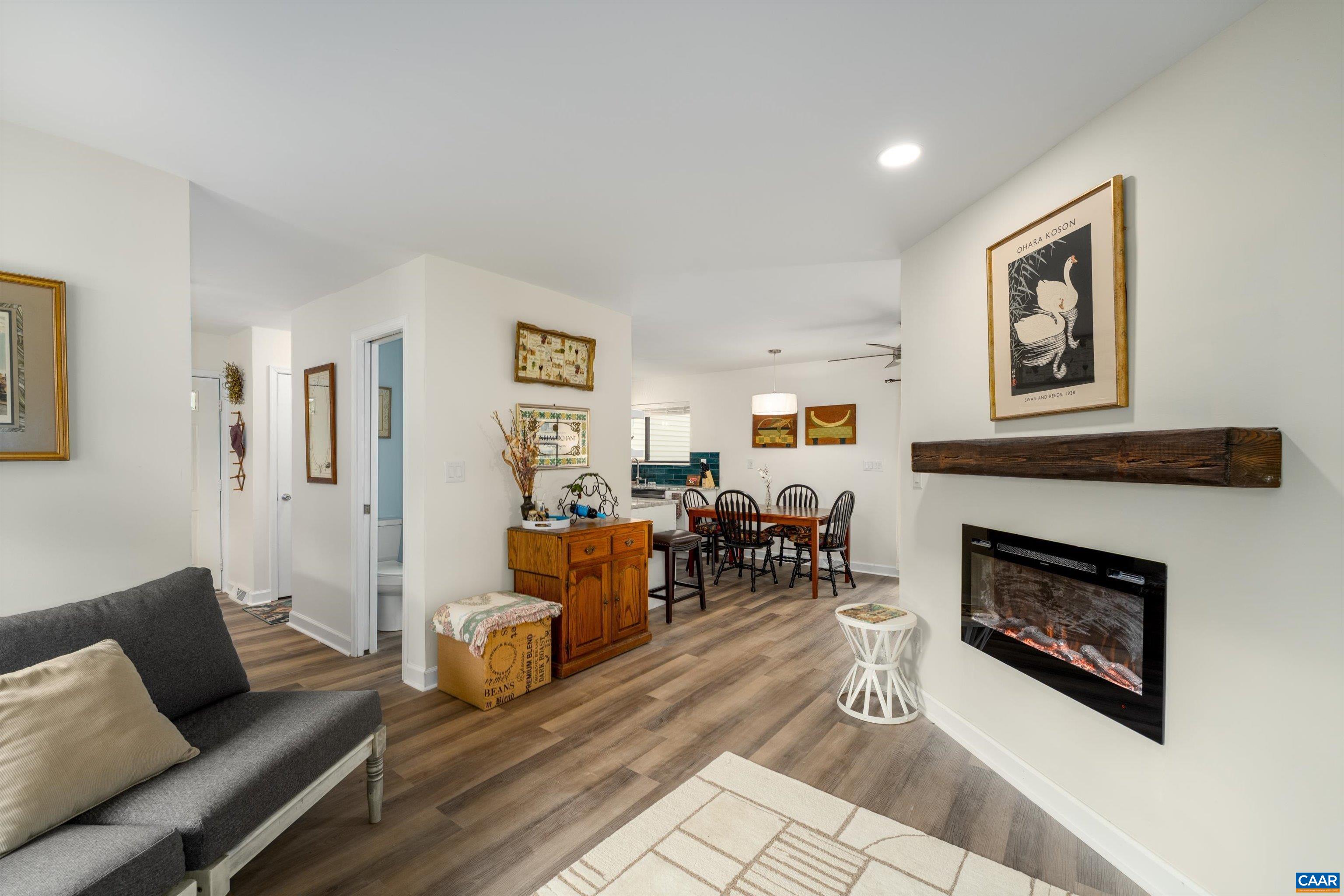 FABYLOUS new price! AWESOME, light filled, renovated home in desirable RIVER RUN.  A charming place to work from home & relax. All new, including luxury vinyl floors with neutral decor, open concept with a cook’s delight kitchen, LG stainless appliances, granite counters, a home office or sitting area off the kitchen with sliding doors to a cozy deck to enjoy morning coffee.   New ceiling fans with dimmers throughout! New wiring at all electrical outlets and switches. All appliances are 2025 ENERGY STAR.  A nice separate utility room is downstairs with storage by the hallway and the two light filled bedrooms.  The primary bedroom is very large with a walk in closet.  Two gorgeous new bathrooms with new plumbing to enjoy; the hall bathroom is great for guests.  2021 new roof.  New 2025 HVAC and  water heater.  New 2025 smoke detectors throughout. New 2025 insulation materials to keep your electric bills low and for best sound barrier from neighbors.  You can easily install a fence with HOA approval for a pet or for privacy. Amazing location being 10 minutes to Route 29, shopping, UVA, PVCC. Pen Park offers tennis & golf. Great rental investment for income. Backs to wooded area for a nice view.