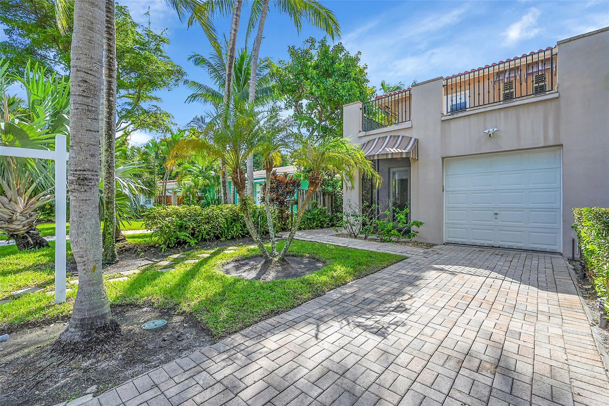 Stylish, completely updated and move-in ready townhome in sought-after Croissant Park, just minutes from downtown Fort Lauderdale, the beach, and FLL Airport. The home offers 9’ ceilings and an open living space with a modern, open kitchen, and stainless steel appliances.  The oversized primary suite features a private balcony, spa-like bathroom, and a walk-in closet.  The garage has been converted into a flexible room—ideal for a gym, studio, or extra storage. Outside, enjoy a private yard with artificial turf and a pergola with motorized screen. Additional upgrades include a whole-house water filtration system and air scrubber. Steps from a neighborhood playground, and four blocks to Croissant Park.
