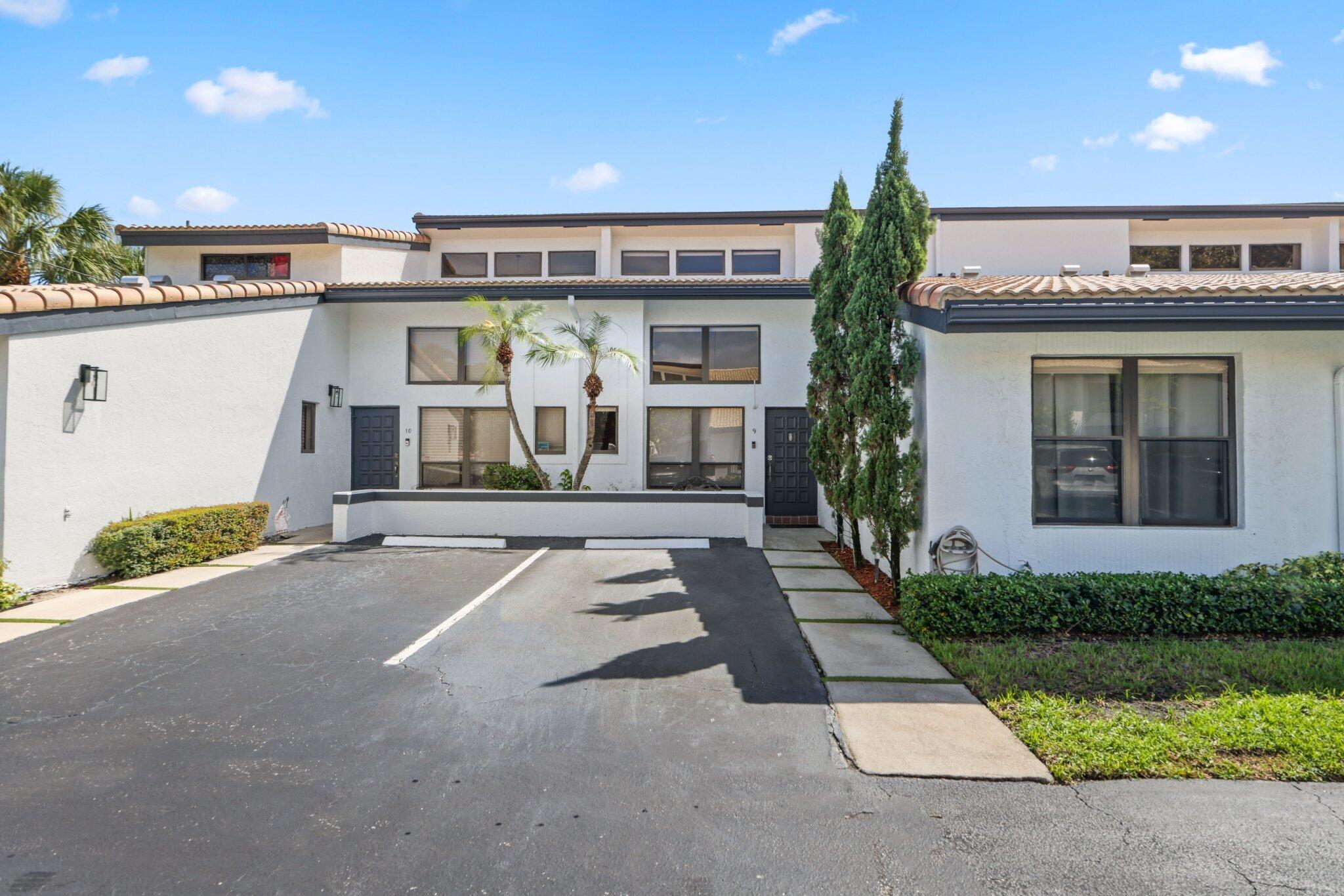 Experience the remarkable location of this updated townhome, offering 1,648 sf of living space. You are greeted indoors by travertine marble flooring and high ceilings that allow an abundance of natural light to flow through the numerous windows. The kitchen is equipped with granite countertops, wooden cabinets, and modern stainless steel appliances. The downstairs features a spacious bedroom, an updated full bath, ample closet space, and washer/dryer. The second floor is dedicated to the primary suite, including an ensuite bath with a soaking tub and a generous walk-in closet. Fenced-in private yard is complete with a deck and low-maintenance turf. The pool is located next to the unit and this boutique community is within walking distance of the beach, Mizner Park, shops and restaurants.