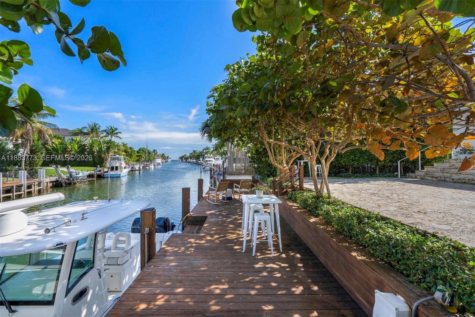 A beautifully appointed waterfront home in the gated community of Gables by the Sea, this 4-bed, 4.5-bath plus den residence spans 4,467 sq ft on a 12,366 sq ft lot with direct ocean access, 50 ft seawall, and private dock. Interiors showcase a chef’s kitchen, custom wet bar, wine cellar, and spacious living areas designed for entertaining. The expansive primary suite offers walk-in his and hers closets and a private terrace. Enjoy alfresco living on the covered patio with saltwater pool. With 3 upstairs bedrooms featuring ensuite baths, 1 downstairs, and a den, this home blends coastal elegance with modern luxury in one of South Florida’s most desirable neighborhoods.