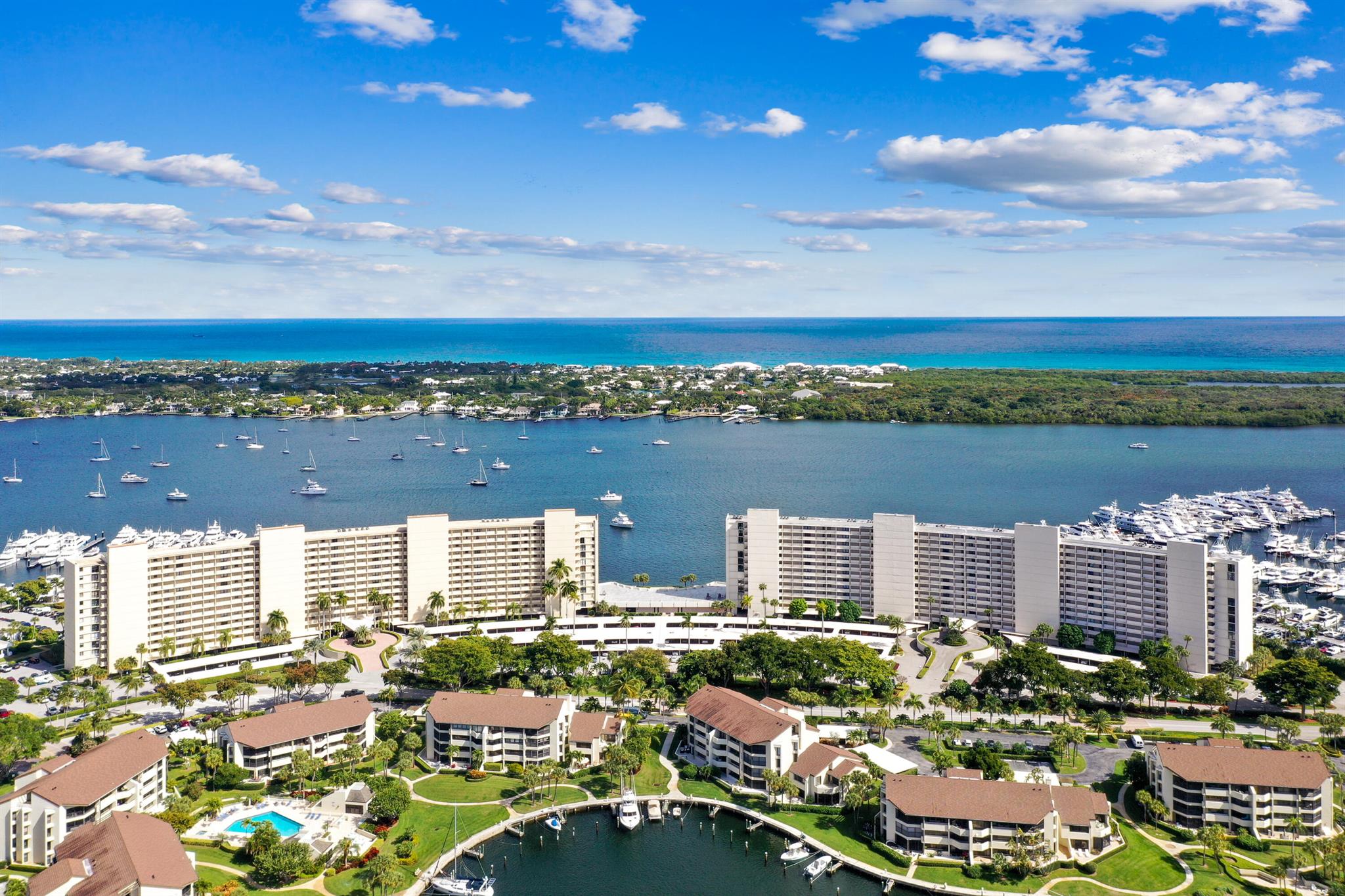 Enjoy beautiful views from your 38 ft. balcony with access from every room. Views of Old Port Cove Lagoon and Marinas.Split bedroom floor plan with separate bath for guests. 2 updated bathrooms. Two-mile walking path along the water. 24/7 Manned gated community. Fitness center with sauna.Walk to Belle's restaurant.