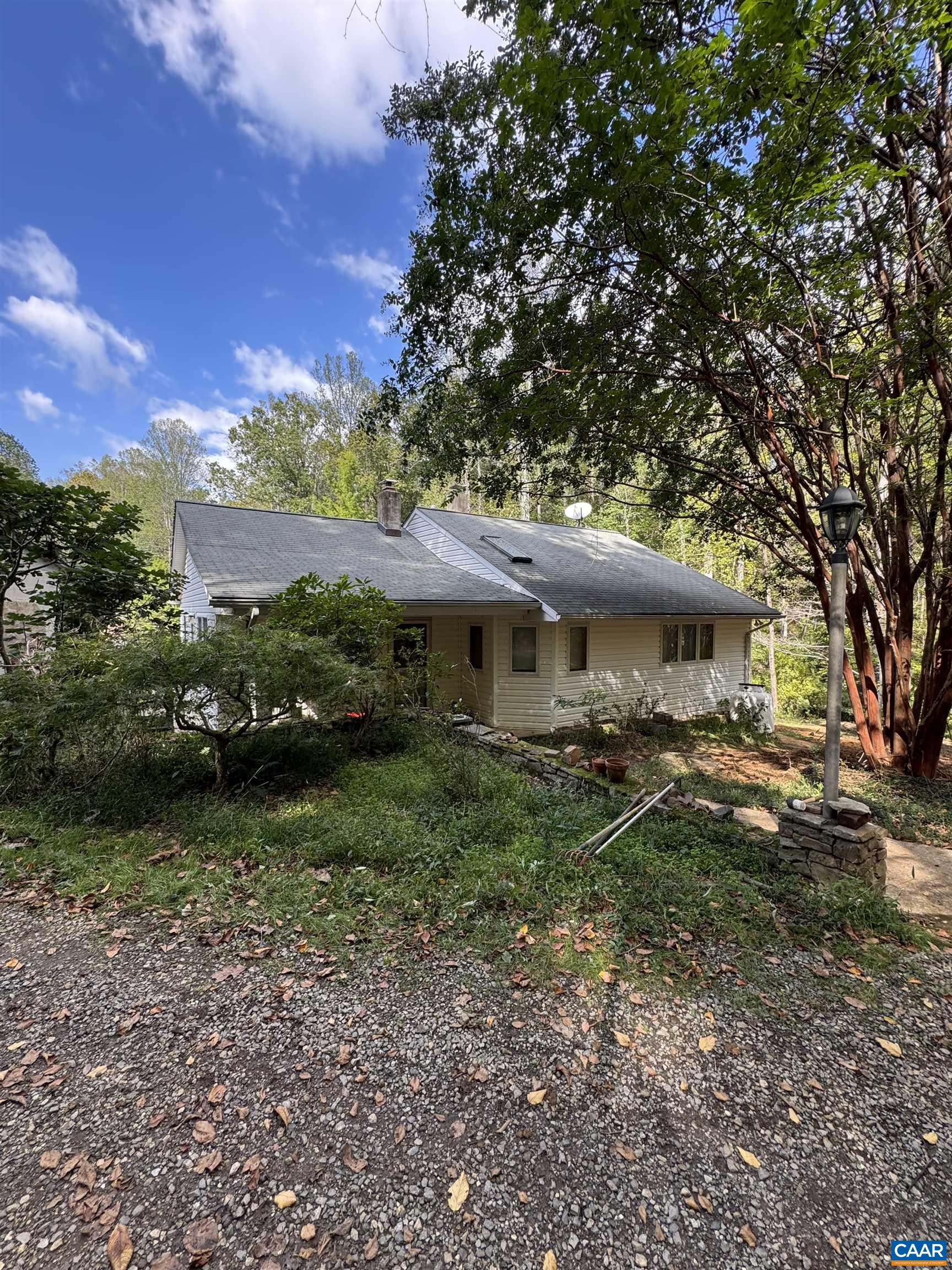 Amazing opportunity to own this private and cozy cottage tuck away on 28 acres of quiet and private bliss. Truely a unique opportunity. The cottage offers main level living.  As you enter the front door you are instantly welcomed with the warmth of the pine floors. The comfortable open floor plan and vaulted ceilings, add to the feeling of spaciousness. Two bedrooms on the main floor, one of which is a huge Primary bedroom. Both bedrooms have plenty of closet space. Huge bathroom with large jetted soaking tub. Third bedroom and second bath are in the basement. Convenient to Crozet, Charlottesville, Nellysford, local wineries, breweries and Wintergreen. No HOA, do as you please.  Multiple house sites. Live in or rent out cottage while building your dream home with mountain views. Multiple springs on the property, wildlife. Great for outdoor enthusiast, hiking, hunting. Plenty of garden space.  Mature hardwoods and abundant mountain laurel. Potential AIRBNB. Huge barn/shop with run-in shed. Plenty of power and high ceilings for wood/mechanic shop almost anything. Barn has second story for storage.  Washer and Dryer on main level. New well. New septic work. Fresh paint upstairs. Don't miss the opportunity to own this hidden gem.