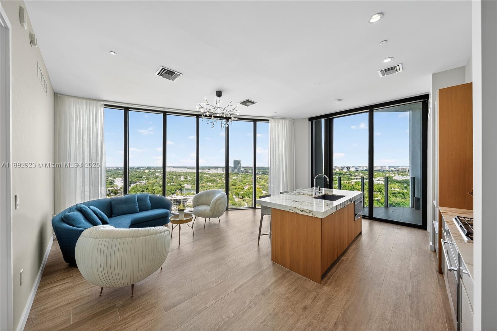 Beautifully appointed 2-bedroom, 2-bath residence with a versatile den and two private balconies. Elegant finishes meet everyday livability throughout. Enjoy resort-style amenities including a rooftop pool, café, spa, wine cellar, private theater, and modern fitness center. Situated in the heart of Coconut Grove, moments from shops, parks, and the marina.