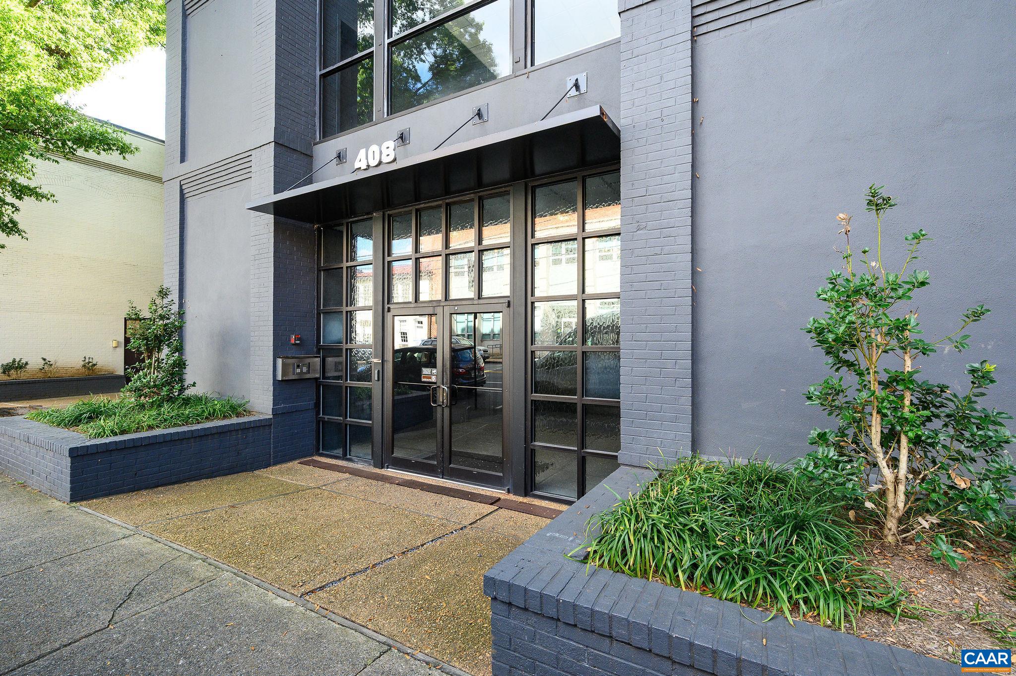 Rare Opportunity to Own a Downtown Condo, in the well located Maclin Building with Mountain Views. Enjoy the views from the top floor, while entertaining, both inside and on the spacious terrace. The floor-to-ceiling windows create a bright dining area and living room. The living room features a gas fireplace with a copper surround and a large built-in bookcase. The galley kitchen is equipped with granite countertops and stainless steel appliances. Terrace access through sliding glass doors from either the living room or the primary bedroom. The Terrace can be enclosed to create a year-round Sunroom.  The primary bedroom offers two spacious closets, and the adjoining full bath includes a dressing area.  The second bedroom is a versatile space that can serve as a den or study. Custom-designed cherry bookshelves, drawers, and cabinets are featured throughout. Laundry closet with a stacked washer and dryer.  Fresh paint and new carpet make this condo "move-in ready." The condo association fees cover a parking space in Market Street Garage, water, natural gas, building maintenance, and additional storage.