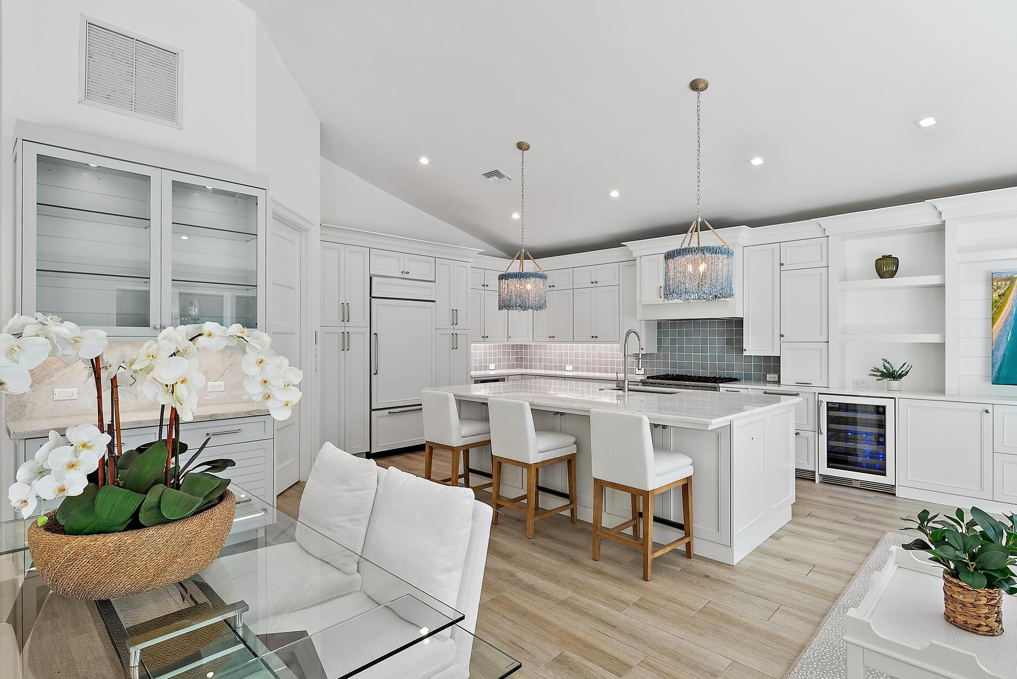 Enjoy your morning coffee and stroll to the beach. This elegant 3-bedroom, 3.5-bath home in the exclusive Jupiter Inlet Colony captures the essence of refined coastal living, where timeless design meets modern comfort.Soaring cathedral ceilings draw in abundant natural light, lending the open interiors an airy, inviting atmosphere. Stackable sliders open completely to the covered patio and heated pool, blending indoor and outdoor spaces for the ultimate coastal lifestyle -- perfect for entertaining or relaxing in privacy. The chef-inspired kitchen is a true centerpiece, featuring a lighted marble island, custom cabinetry, premium gas appliances, and designer finishes that combine function with beauty. Every detail throughout the home has been thoughtfully curated &#x14; from the bespoke built-ins and wallpaper accents to elegant lighting and window treatments.

Outdoors, lush tropical landscaping, ambient lighting, and a mosquito control system make every evening feel like a getaway.

Nestled within one of Jupiter's most prestigious seaside enclaves, residents of Jupiter Inlet Colony enjoy private beach access, an optional Beach Club membership, a private marina and yacht club, and a dedicated community police department &#x14; offering luxury, serenity, and peace of mind in one of South Florida's most desirable coastal settings.Modern Enhancements: Recent upgrades include a brand-new garage door (3/24) and water heater (3/24), ensuring effortless comfort and reliability.
Generous Dimensions: 2,654 sq. ft. under air and 3,374 sq. ft. total, situated on an expansive 105 x 90 lot.
240 single-family residences offers unparalleled privacy and exclusivity.
Residents enjoy access to pristine, sun-drenched beaches and a wealth of lifestyle amenities, including:
An optional Beach Club membership for social gatherings and relaxation.
A private marina and yacht club, ideal for boating enthusiasts.
A dedicated community police department for added peace of mind.
Additional Up-Grades:
Kitchen:
Larger Island (including larger sink)
New appliances: refrigerator, dishwasher, wine cooler, refrigerated drawers
Lighted marble island countertop
Countertops
Backsplash
Island sconces
Custom built in Bar with lighting
Custom Built ins with bookshelves and drawers
Wallpaper
Hardware
Draperies and Shades

Laundry Room:
Washer/Dryer
Custom built ins
Hardware

Living Room/Entry:
Chandlier
Shiplap
Drapes

Powder Room:
Custom built ins
Mirror
Scounces
Wallpaper
Counter top
Faucet
Toto toilet
Hardware

Bobby Bedroom/Bathroom:
Closet built ins
Draperies/shades

Wallpaper
Shower Door
Toto Toilet
Roeburn medicine cabinet

Mia's Bedroom:
Chandlier
Wallpaper
Draperies/Shades

Mia's Bathroom:
Built Ins
Mirror
Wallpaper
Plantation Shutter
Faucet
Toto toilet
Countertop

Master Bedroom:
Closet
CA Closets
Wallpaper
Draperies

Master Bathroom:
Wallpaper
Built Ins
Hardware
Marble Countertop
Faucet
Toto toilet
Shower door
Water Heater
Scounces
Mirror
Robern Medicine Cabinet

Garage:
Floor
Built In Cabinets
Insulation
Tankless Water Heater
Split A/C
Garage Door
Hot water sink

Outside:
Lighting on front of house
Pavers on side of house
Mosquito System
Two a/c units
Ceiling fan
Back porch wicker chandeliers