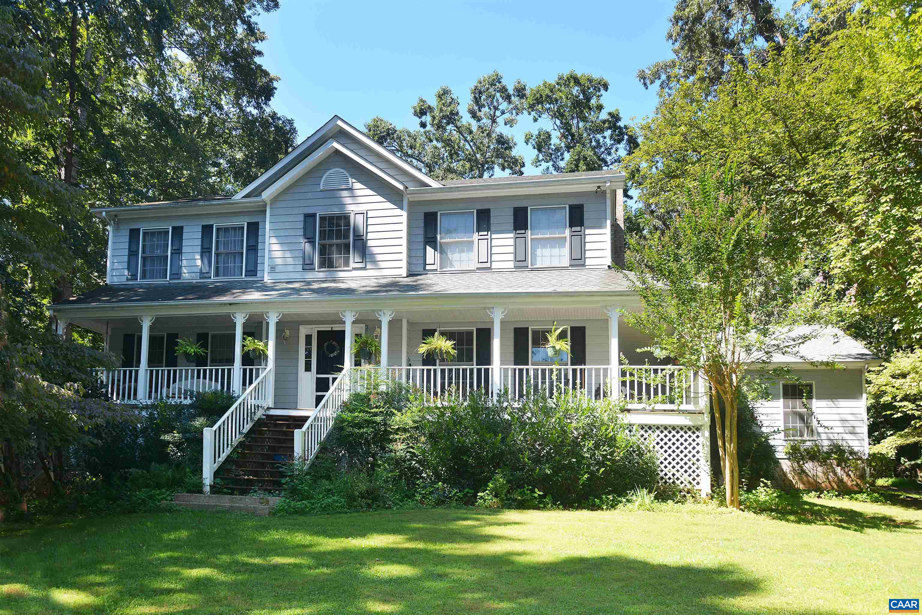 IVY - Offered for the first time by the original owners, this spacious and comfortable two-story house is privately situated on 2.26 acres. Located in the Langford Farms neighborhood it offers a quiet cul-de-sac setting in a well established and desirable neighborhood of Ivy. The main level features a bright and fully equipped kitchen with a bay window adjacent family room with fireplace, living and dining rooms, full bath, flexible space for home office/library and attached two car garage. Four large bedrooms are upstairs with a generous size primary suite and bathroom. A second full bath and laundry room complete the layout.  Lovingly maintained with upgrades such as new roof in 2019, new heat pump and wood floors. The residence is situated in a peaceful setting with a full wrap around front porch and generous decks for entertaining across the back. Mature trees and landscaping accent the fully enclosed back yard for children and pets. Located in the Virginia L. Murray/Henley/Western Albemarle  school districts, the  property offers a quiet country setting within minutes access to the University of Virginia, Downtown Charlottesville and I-64 for points east and west.