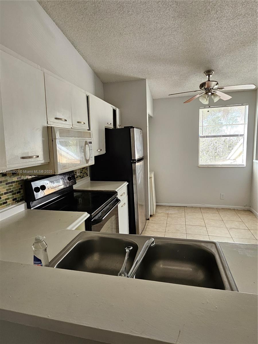 Well-appointed guest bedroom at 2511 56th Ave - Condo in Lauderhill