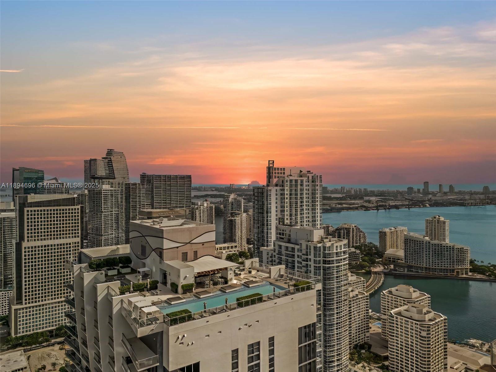 Spectacular upgraded unit at the iconic 1010 Brickell Condo. Unit features: 2 beds, 2 baths, Stone-like porcelain tile floor, glass-enclosed shower, custom made closets, window treatments, 9-foot ceiling heights, top of the line Smeg appliances, among others! Live & play in this luxury building that offers: outdoor movie theatre, restaurant & swimming pool at 50th floor roof top; Co-ed Hammam spa w cold & hot Jacuzzi, massage & treatments rooms, sauna & steam room at 12th floor; basketball & racquetball courts, running track, indoor heated swimming pool, fitness center, party room w kitchen, open terrace & barbeque, kids room w bowling, virtual golf simulator, ping-pong, among others. Excellent location next to public transportation, Brickell City Centre, & more.