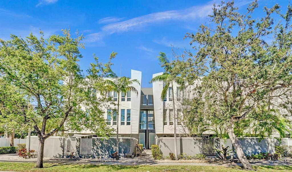 ***MOTIVATED SELLERS***     Exquisite 3 Bedroom, 3.5 Bath modern townhome with a 2 CAR GARAGE showcases a sophisticated open concept design, featuring a chef’s kitchen with premium quartz countertops & modern cabinetry. Towering ceilings & grand IMPACT windows flood the home in radiant natural light. The 1st floor boasts a luxurious bedroom & spa-like bathroom, opening to an elegant patio. The 2nd floor offers a gourmet kitchen, refined dining, opulent living area, & a chic half bath. The 3rd floor primary suite indulges with a vast walk-in closet, lavish walk-in shower, & dual vanities. The 3rd bedroom has an ensuite bathroom. Washer & Dryer are on the third floor. Near Whole Foods, fitness & boutiques, airport, fine restaurants, upscale shops, and pristine ocean! New Roof & newer AC!