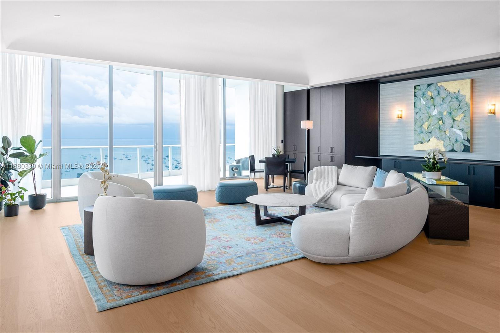 Experience elevated living in this exquisite LPH at Grovenor House, spanning 6,920 SF with 5 bedrooms, office, and 7.5 baths. Occupying half of the 31st floor, this residence showcases panoramic sunrise and sunset views of Biscayne Bay, the Miami skyline, and Key Biscayne Bridge. Designed with impeccable detail, it features soaring ceilings, floor-to-ceiling glass, custom millwork and walk-in closets, a wine cellar, and a chef’s kitchen with Snaidero cabinetry and Sub-Zero, Wolf, and Miele appliances. Expansive terraces total over 2,000 SF of outdoor space. Includes 6 parking spaces and 6 storage units. Grovenor House delivers resort-style amenities, nautical-themed lobby, infinity pool, spa, fitness center, tennis court, kids’ play area, and more.