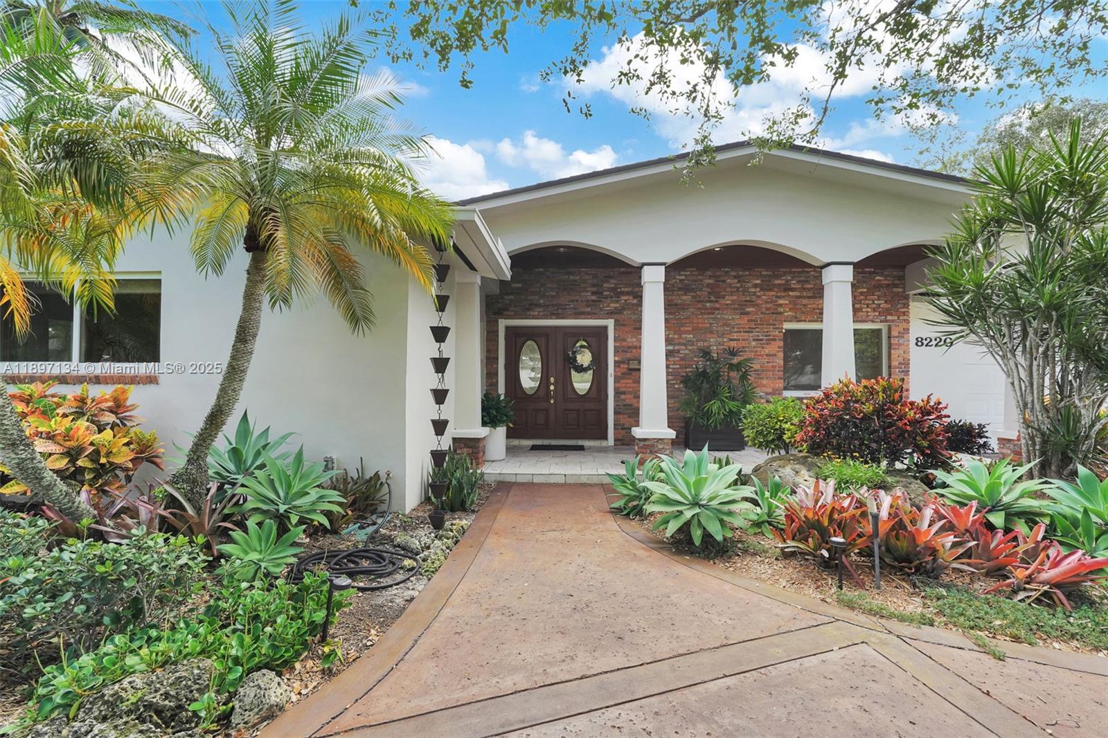 Located in the heart of Palmetto Bay, this meticulously maintained 4BR/3BA home is where memories are waiting to be made. The remodeled eat-in kitchen and wet bar are perfect for entertaining. Enjoy a private tropical oasis featuring a pool, built-in outdoor kitchen, pergola dining area, fire pit, and space to garden or play horseshoes. Generously sized bedrooms offer comfort, while the primary suite boasts a large walk-in closet, and a renovated spa-like bath offers natural light and high ceilings. Ample parking includes a circular driveway, 2-car garage, and covered car/boat port. Walking distance to A-rated schools and parks—don’t miss this special home! Available furnished or unfurnished, and also available for 6 month rental.