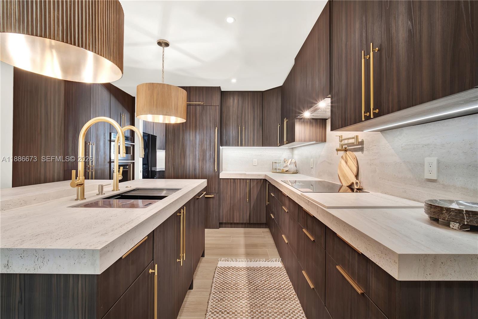 Step into luxury with this immaculate 3 bedroom 2.5 bath home, perfectly situated in one of Coral Gables most desirable locations, just steps from world class dining,shopping, A plus schools both private and public. This Residence showcases every imaginable upgrade featuring elegant designer lighting, custom fixtures and appliances throughout, The open layout flows into a spacious back patio and yard.The chefs kitchen includes panel designer appliances, custom cabinets proline exhaust hood with center island, butler pantry with additional sink refrigerator and washer dryer, which flows into the oversized 2 car garage, Impact windows and doors, Second floor Master is secluded with private retreat ,double marble floating vanity's, walk in shower with porcelain tile frameless glass