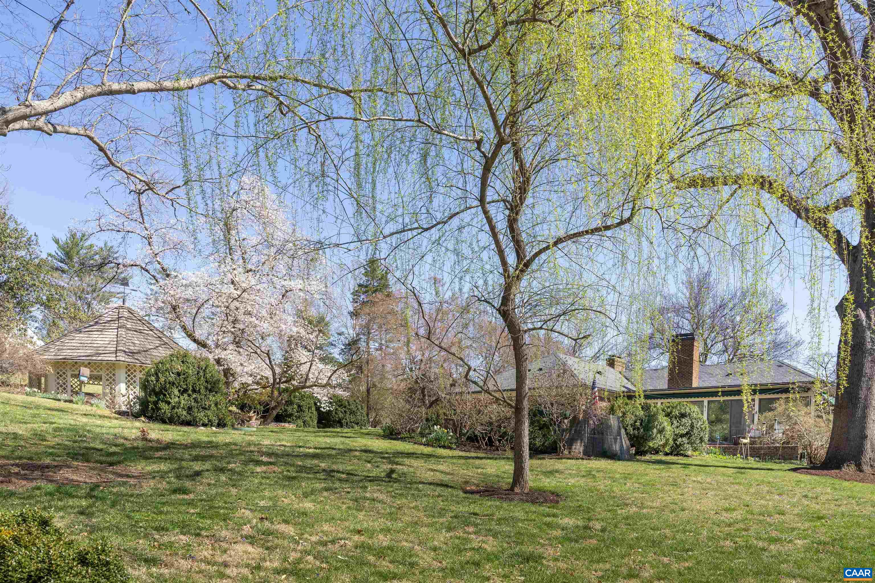 A remarkable property in Bellair.... Set on a 1.9 acre beautifully landscaped, elevated lot...Magnificent trees and grounds...Gracious and comfortable....Unique and gracious floor plan ...Living room(w/FP) and dining rooms with floor to ceiling walk-in bay windows, family room with fireplace opens, to the bright sunroom overlooking the stunning pool setting...Many custom features: copper gutters, slate roof, 2 sunrooms, circular driveway to the front entrance, lower driveway to the terrace level...Full terrace level with french doors open the family room has built-in bookcases, masonry fireplace, huge wet bar, room for a pool table, wide corridor to study, laundry room and playroom...