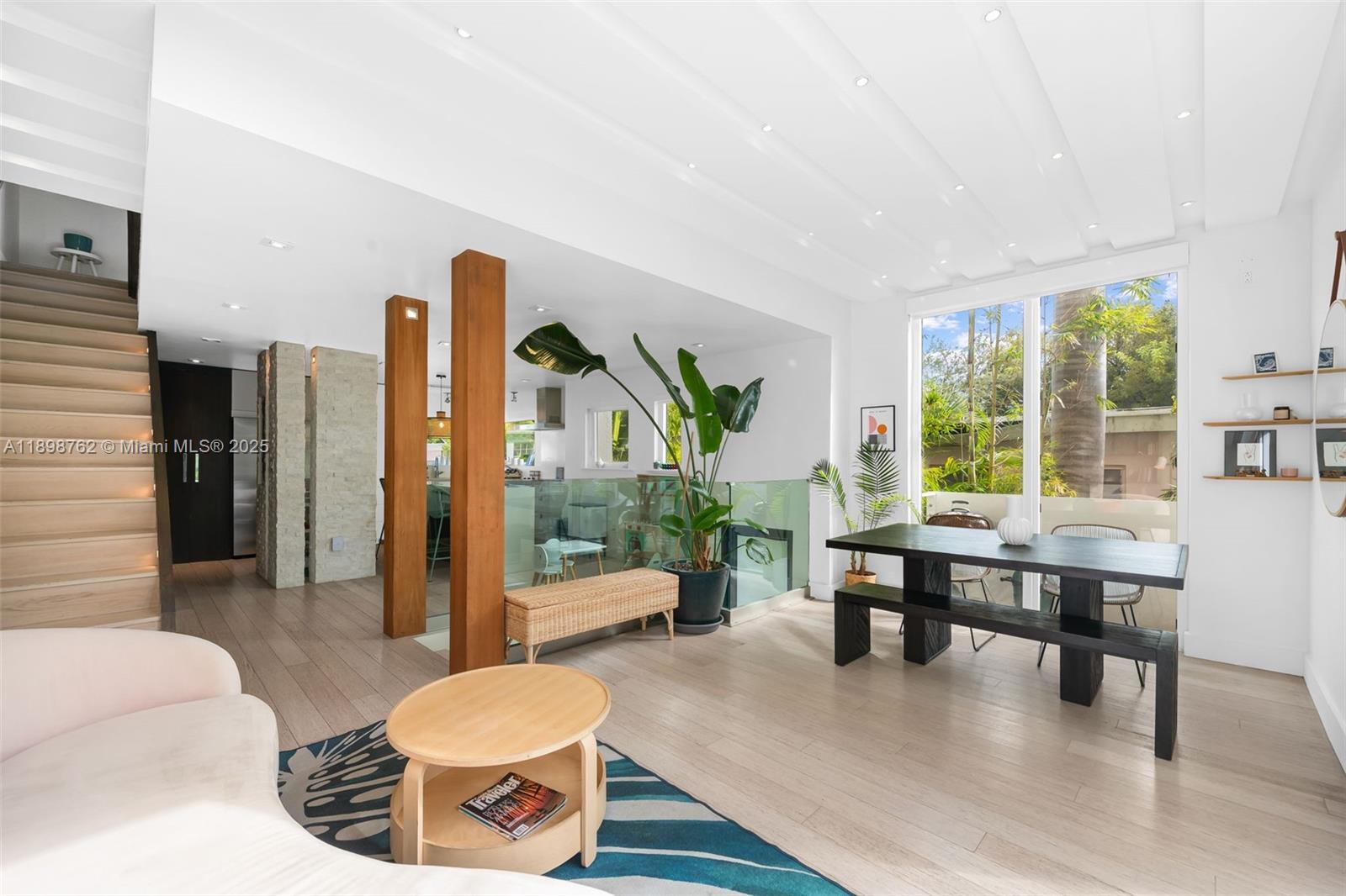 Rare opportunity to own an exceptional tri-level corner townhouse in the heart of Miami Beach, offering 4 bedrooms, 3.5 baths, and 2,120 sq. ft. of interior living space with abundant natural light. Includes a versatile ground-level studio with full bath—ideal for office or guest suite. Outdoor living features three balconies including a jacuzzi, plus a private patio with mature landscaping. Full hurricane-impact windows and doors, newer roof, water filtration system, and two covered parking spaces. Open kitchen with tons of cabinet space, large island & bar seating. Bathrooms renovated with steam shower, dual vanities, & soaking tub. Elegant wood flooring, generous closets. Located across from Flamingo Park sports facilities & short walk to markets & restaurants. True Miami Beach living.