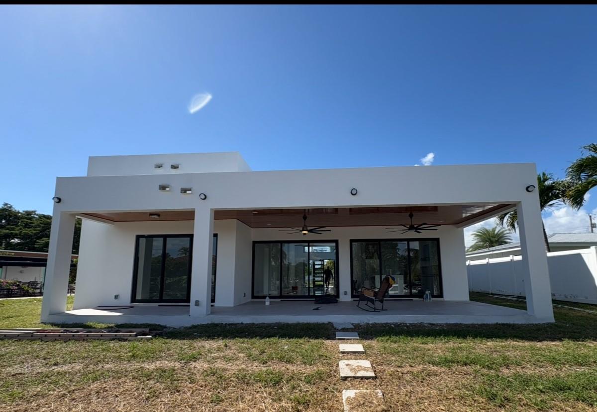 Luxurious back porch. With hardwood ceiling and Italian tiles. Sit, sip, relax. Take in the view and the breeze