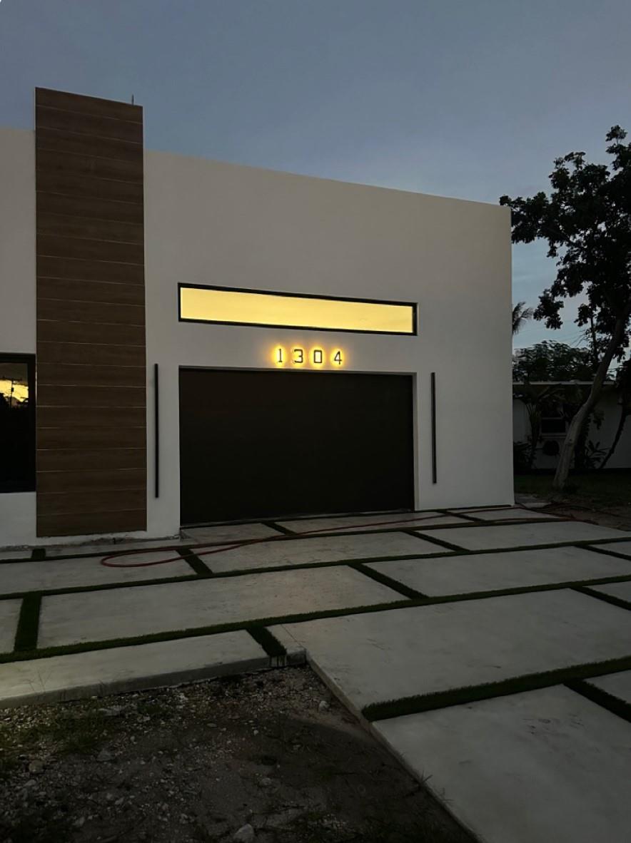 Garage made perfect for your golf cart, car. The 12 feet ceiling provide plenty of overhead storage space. Clean, organized, beautiful. Plenty of light for the sports enthusiast. Do you see a home gym???