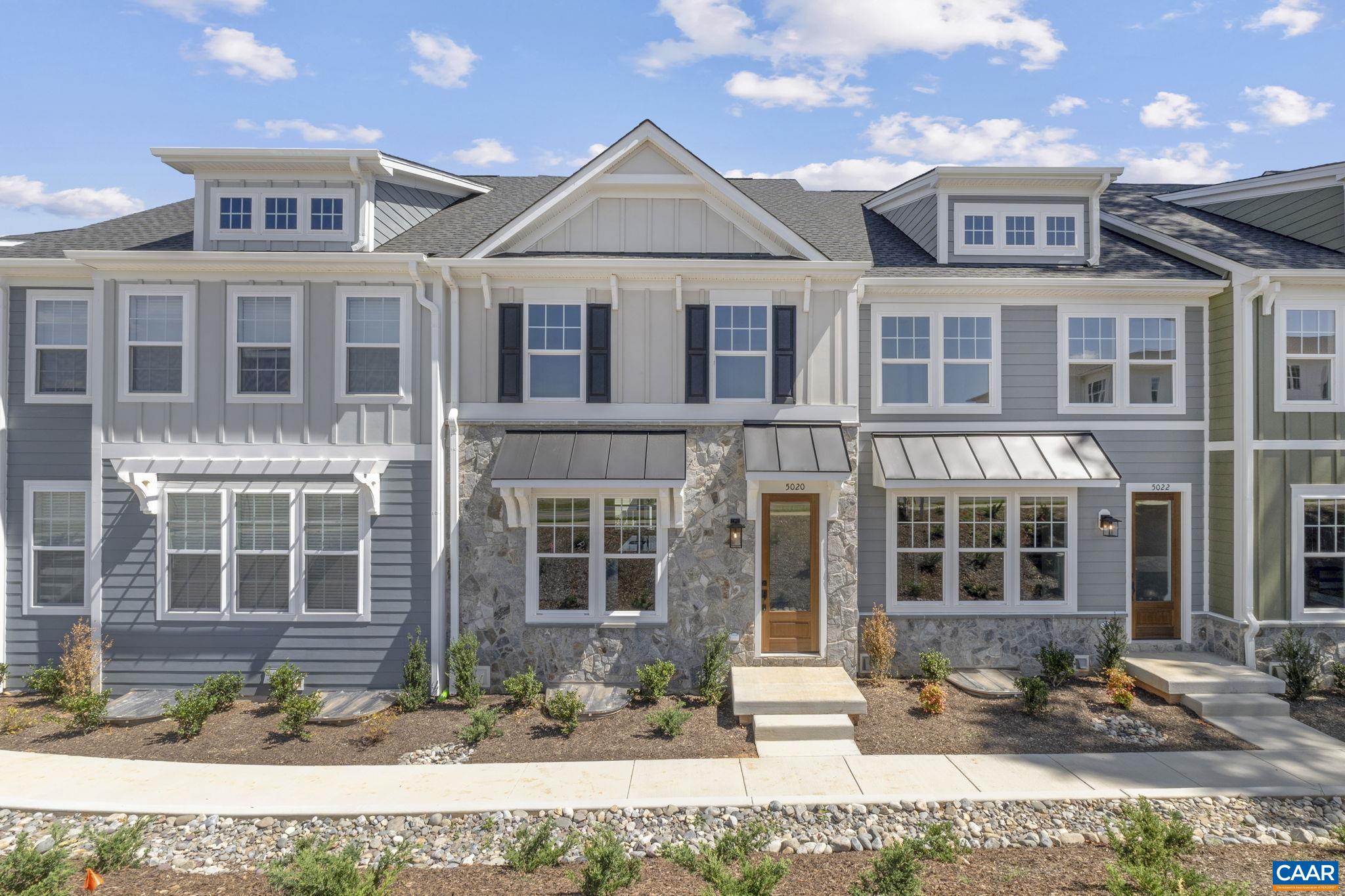 Just completed - actual photos! The Dogwood townhome at Dunlora Park offers a well-planned layout just minutes from Downtown Charlottesville. Step inside from the front entrance and you'll find a bright, open main level with a comfortable living area, roomy kitchen, dining space, and a walk-in pantry. A half bath and low-maintenance deck round out the first floor, offering an easy spot to gather or relax. Downstairs, the attached two-car garage leads directly into a finished rec room. Upstairs, the second floor includes a spacious primary suite with private bath, two additional bedrooms, a full hall bath, and laundry area.