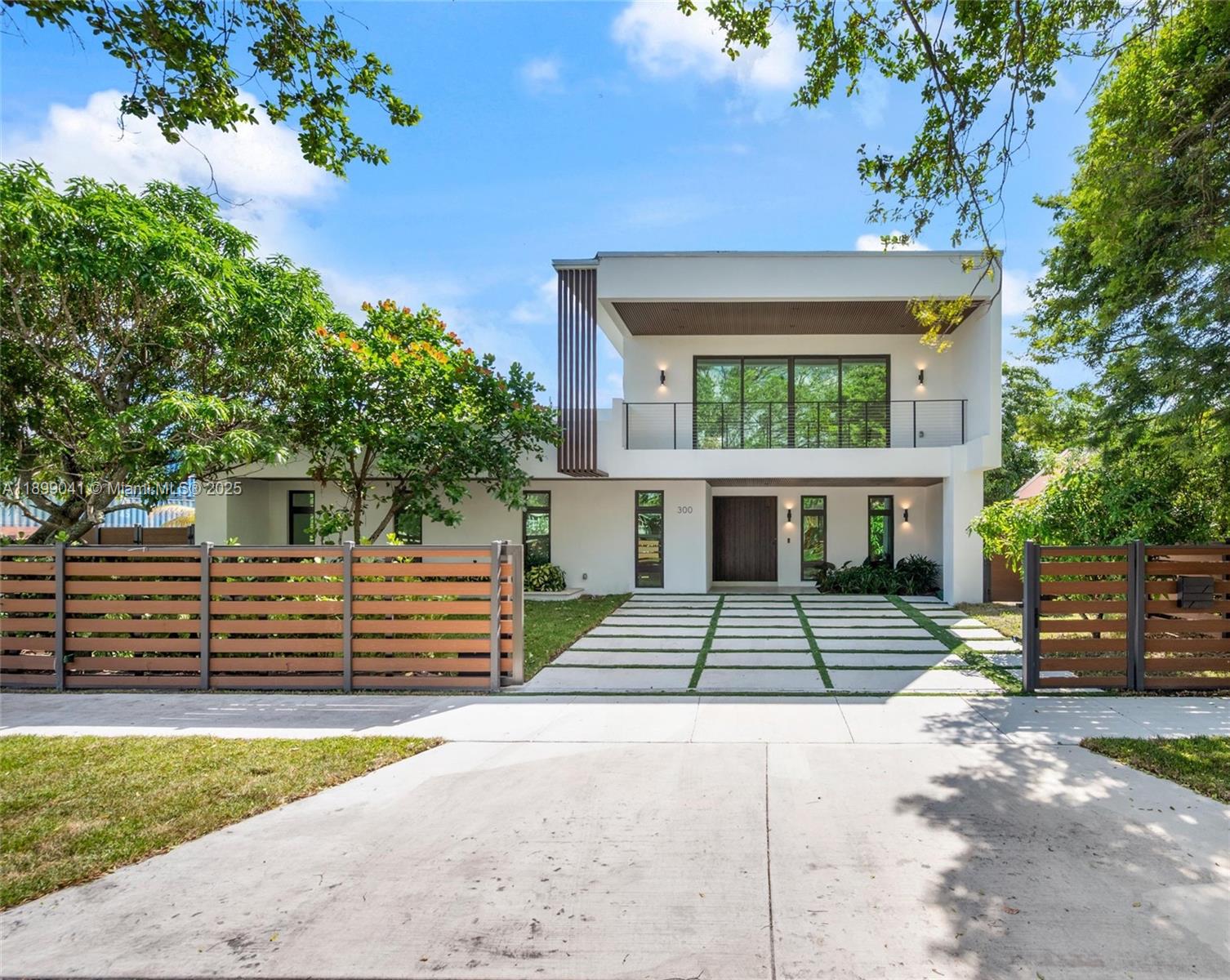 Fully Completed & Move-in Ready! A masterpiece of modern luxury & design in the heart of Buena Vista, this brand new 4,200 SF (total) residence is nestled on a corner lot w/ electric gates. Enter through a striking 8’ x 6’ pivot door to find sun-filled living areas, & a custom Italian kitchen w/ island, quartzite countertops, & high-end appliances. Porcelain floors flow throughout, complemented by real white oak stairs & sleek recessed lighting. All bedrooms have ensuite baths w/ built-out closets & hidden-hinge doors, including the primary suite which has a balcony, soaking tub, separate shower, dual vanities & private water closet. Outdoors, enjoy a private fenced backyard w/ heated saltwater pool, spa, summer kitchen & lush landscaping including 12’ regapon trees. NOT IN A FLOOD ZONE!