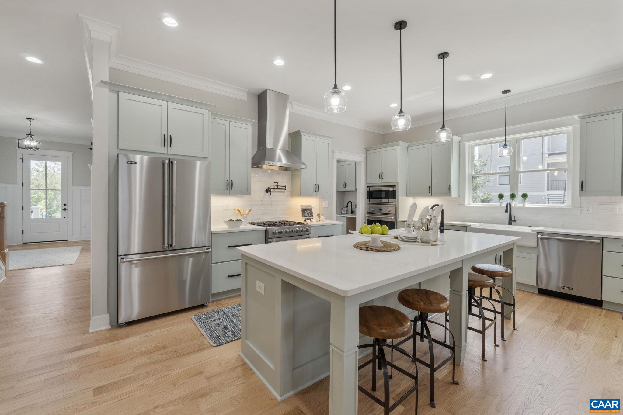 This custom built Belvedere stunner is Gibson Homes new construction and loaded with high end finishes. Finished in place hardwood floors w/ flush mount registers, solid core doors, Viking appliances, custom built-ins, solid closet shelving, 10 ft. ceilings on main level, coffered ceiling, and the list goes on... Sited on a corner lot, enjoy park and mountain views from one of the double stacked 10x16 decks. A chef's dream kitchen complete with an oversized pantry,  9 ft island, porcelain farm sink, prep sink and pot filler and a wet bar butler's pantry make entertaining a breeze. Delightful oversized stamped concrete patio! Thoughtful use of storage space and generously sized bedrooms. The walk up basement (with plumbing rough-ins and framing in place) offers so many possibilities for future expansion. The detached 2 car garage complete with an extra parking pad includes a finished carriage house above which can be rented or can be a perfect au pair suite, mother in-law apartment or private office. Owner/agent.