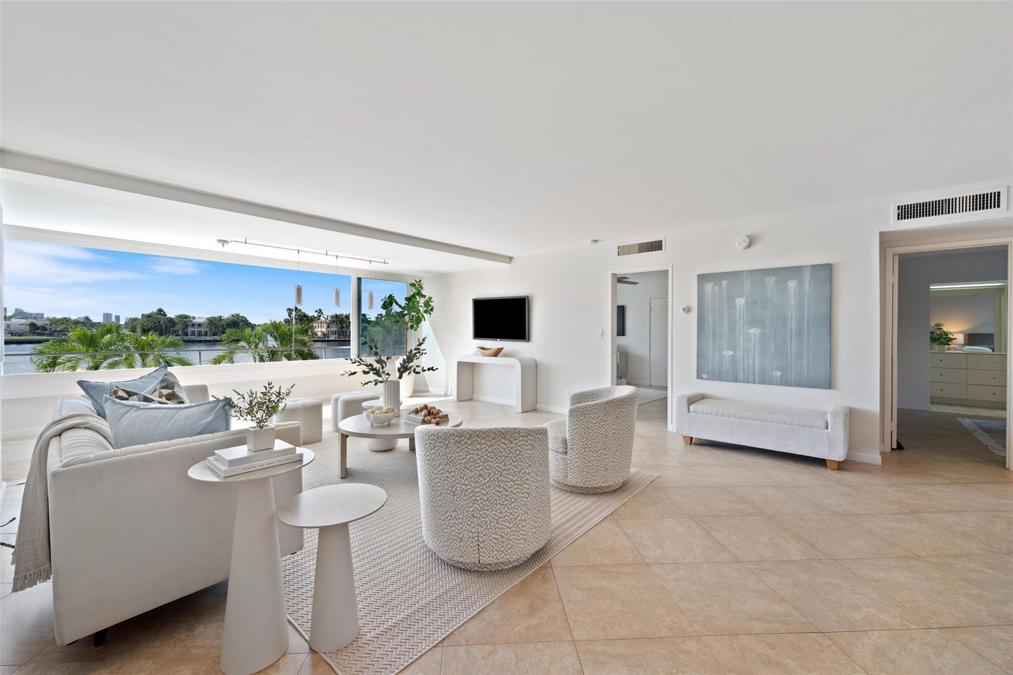 Amazing direct Intracoastal views. This second-floor spacious, 2/2 offers panoramic water views and a front row seat to the daily boat parade. Wall-to-wall stacking impact windows seamlessly blend indoor-outdoor living. An open-concept layout with a large kitchen, freshly painted and tile flooring throughout. The Versailles, an architecturally striking mid-century modern boutique building just one block from Fort Lauderdale Beach. Enjoy the convenience of being moments from world-class dining on Las Olas Blvd and nearby beachfront restaurants. A Water Taxi stop is just one street away. A stunning new pool deck, and brand-new roof nearing completion, adding to the building’s appeal and long-term value.