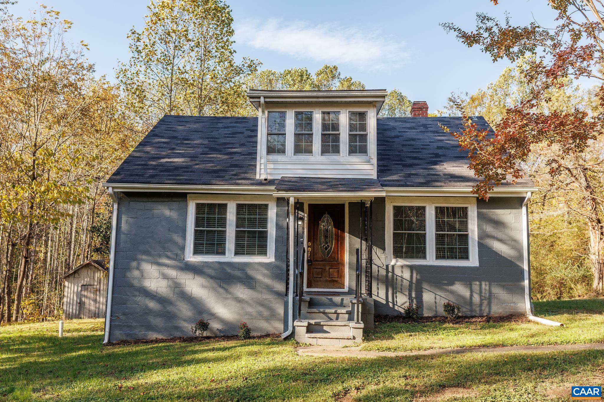 Seller offering $6000 towards closing cost with acceptable offer. Tucked away in a peaceful setting, this beautifully remodeled Cape Cod home offers the perfect blend of charm and modern comfort. Featuring 3 bedrooms and 2 full baths, this home is move-in ready and full of thoughtful updates throughout. Step inside to an inviting layout with updated finishes, fresh paint, and original hardwood flooring. The first-floor primary bedroom includes a gorgeous en suite bath, creating a private retreat for relaxation. Upstairs, you’ll find two additional bedrooms ideal for family, guests, or a home office. Relax in the morning and evenings on your screened in porch. The unfinished basement provides plenty of potential for expansion, storage, or a future recreation space. Surrounded by trees and tranquility, this home offers a sense of privacy while still being conveniently located to the Town of Scottsville only 10 mins away and 20 mins to Charlottesville. 2 Additional parcels available for sale surrounding the home.