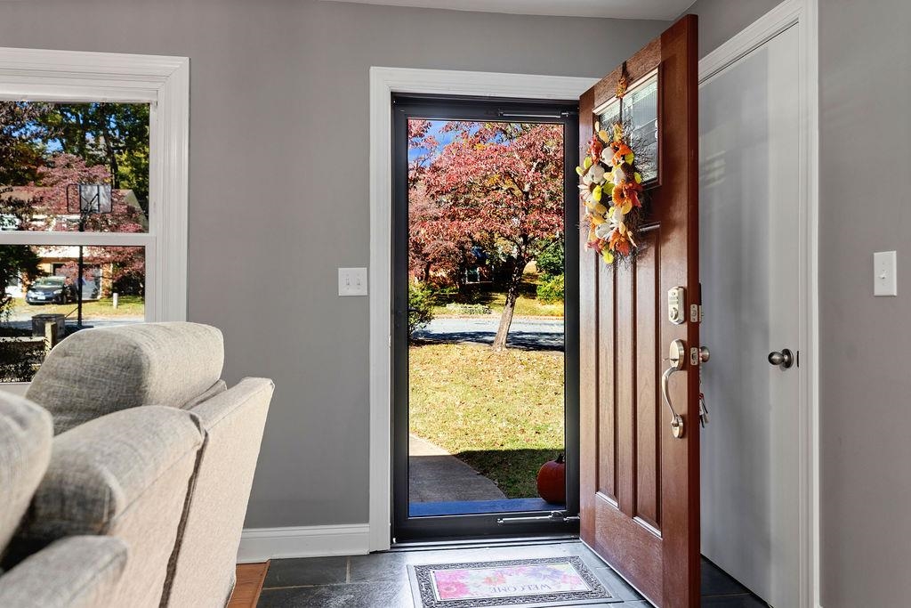 Tucked away on a quiet cul-de-sac with no through traffic, this beautifully updated  3-bedroom, 2.5-bath home offers the perfect blend of city convenience and natural tranquility.  The kitchen, dining room, and living room were taken down to the studs and completely renovated, featuring modern finishes, new lighting, and a fresh, open layout, perfect for everyday living and entertaining. The hardwood floors on the main level have been beautifully refinished, adding warmth and charm throughout. Even the carpeted areas hold a secret—original hardwood floors lie beneath, ready to be rediscovered.  Enjoy easy one-level living, a peaceful wooded backdrop that grants direct access to the scenic Rivanna Trail and all the warmth and charm that Charlottesville have to offer.  All this and more are waiting for you!