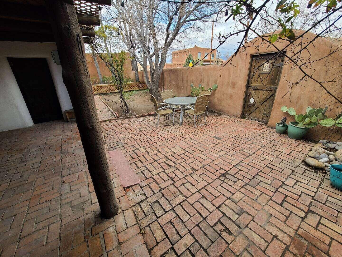 Historic Old Town Adobe Charmer - Walk to the Plaza, Sawmill, and moreRelax and indulge in the vintage charm of this fully renovated Historic Old Town home. Built in 1901, this spacious 1300 sq/ft home has been meticulously restored to bring modern touches while staying true to it's historic roots. Enjoy the amazing comfort of 18-24'' adobe walls. The house is wonderfully comfortable with a 3 zone mini split and 2 fireplaces. There is a new TPO roof and the home is wonderfully quiet and peaceful.You are a block away from Old Town plaza, Tiguex Park, The Museum of Natural History, The Albuquerque Museum, Explora, The Sawmill District and so much more!