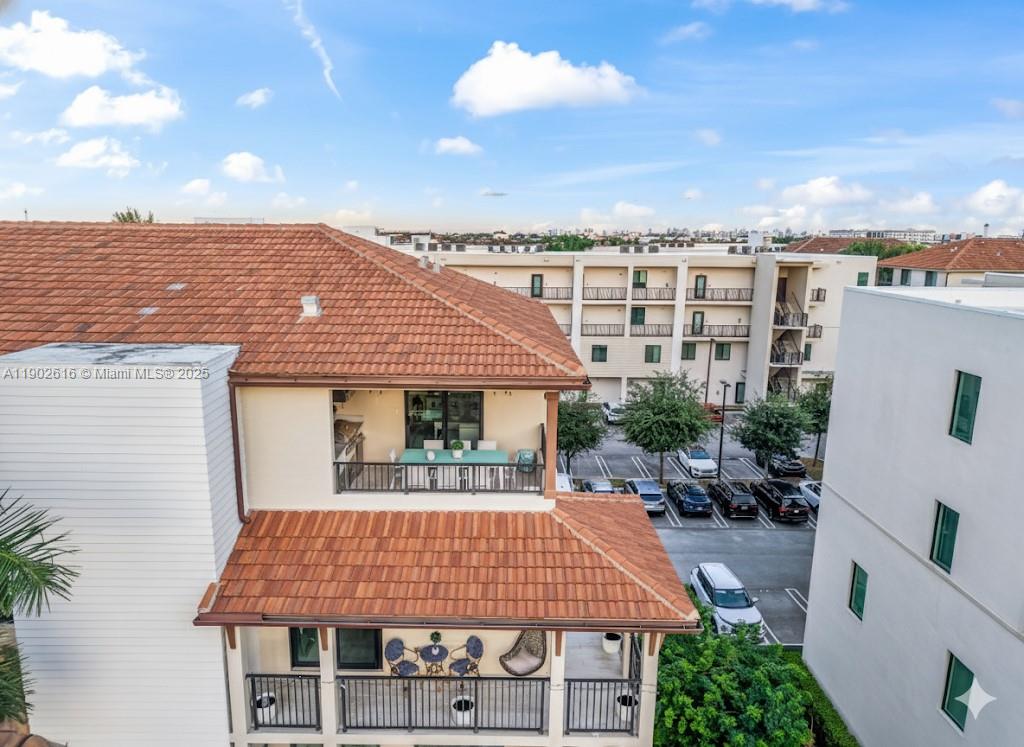 Exceptional Upgraded Corner Townhome in Downtown Doral. Step into the heart of Downtown Doral and experience elevated urban living at its finest.This modern 4-story corner residence with a private elevator redefines luxury with 3 wraparound balconies, including a rooftop cookout kitchen, and designer finishes throughout.Enjoy 3 elegant living areas, 3 bedrooms, 3 full baths, and 2 half baths, all filled with natural light from impact windows and soaring ceilings.The gourmet kitchen boasts quartz countertops, stainless steel appliances, and an island perfect for entertaining. Retreat to a spa-inspired primary suite,  private garage.Unwind at the exclusive clubhouse featuring a fitness & business center, resort-style pool, and basketball courts.Walk to restaurants, shops, & top-rated schools