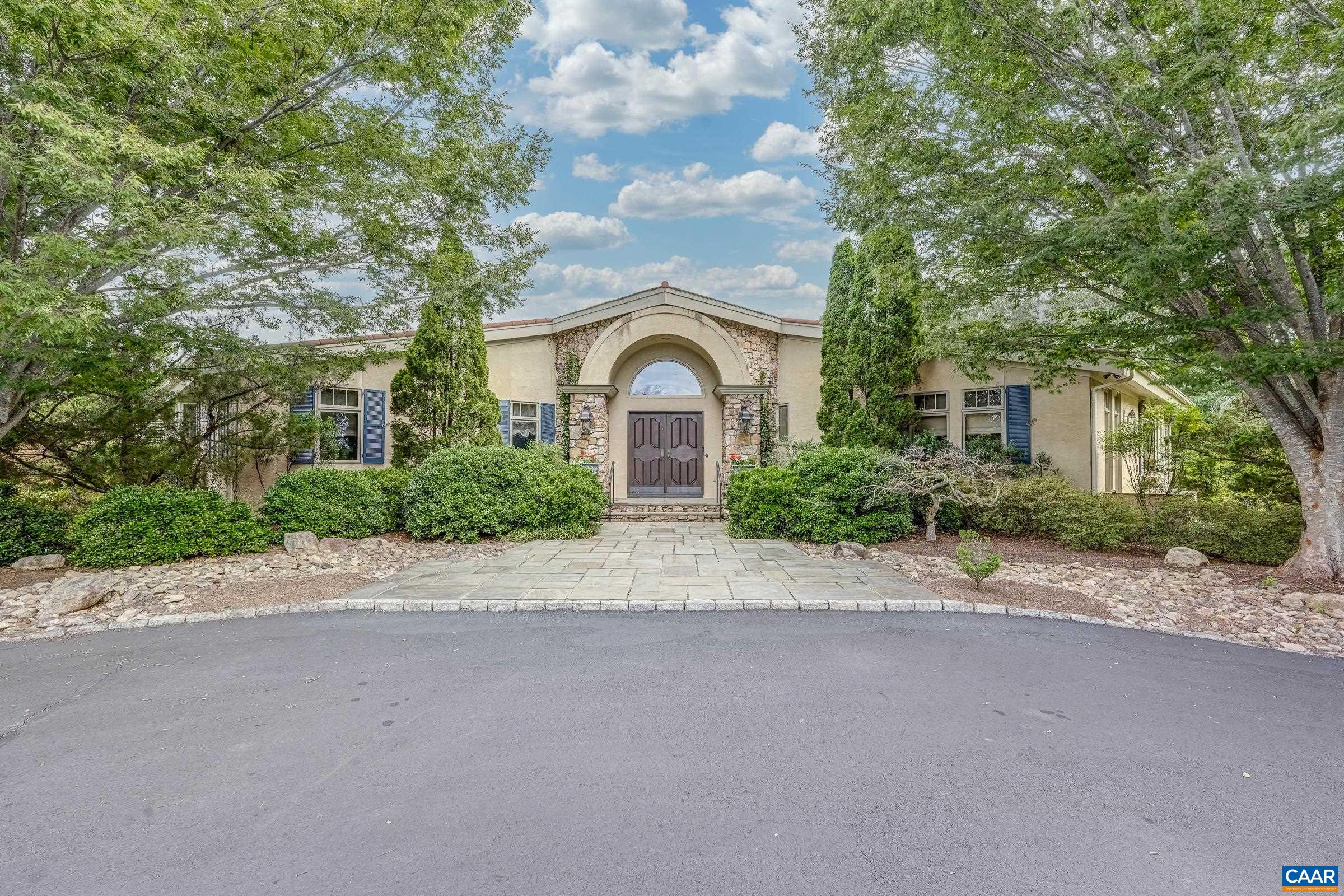 Stunning Tuscan Style home located in the heart of Keswick, privately set on 2 parcels! totaling 57.27 acres with lake and Southwest Mountain views. Every detail of this home was planned with an artists keen eye in creating a Mediterranean inspired retreat. Features include one level living at its finest, great room with soaring beamed ceilings, floor to ceiling stone fireplace, large transom windows furnish abundant natural light and capture outdoor living space, lake views, landscaped beauty, pool and outdoor fireplace. Floor to ceiling custom built-ins create space for books and other treasures, with a formal dining room and library completing the picture. Follow the Saltillo tile flooring through a cozy den to a spacious kitchen and center island. 3 Beds/3 Full and 1 Half Bath. Primary Suite offers a sitting/dressing area and creates a relaxing and luxurious sanctuary. Artists studio with 2 additional bedrooms share a full bath while a third full bath/changing area is conveniently located near the pool entrance. The 2 car garage has extra space for golf cart or riding mower. This home is a one of a kind offering not to be missed. Appt. Only. Do not disturb!! Note: listing is for 2 parcels, online values are incorrect.