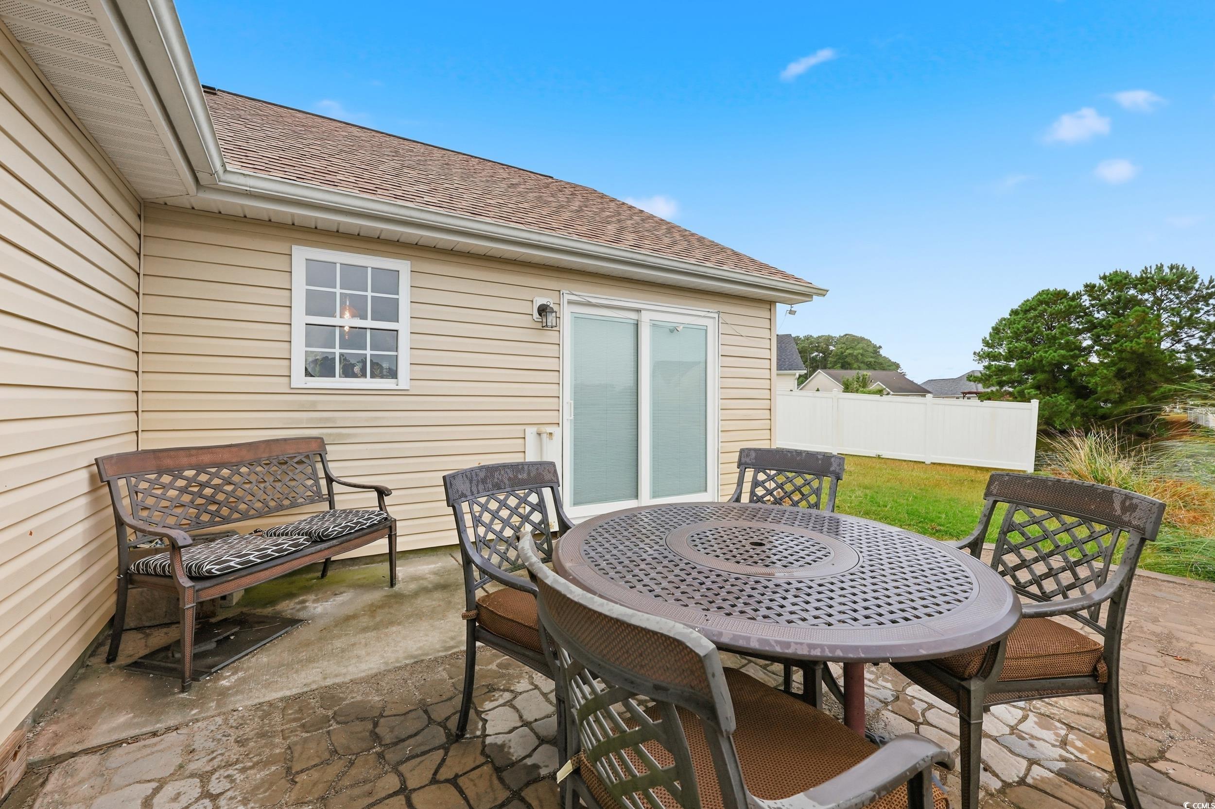 View of patio with outdoor dining space