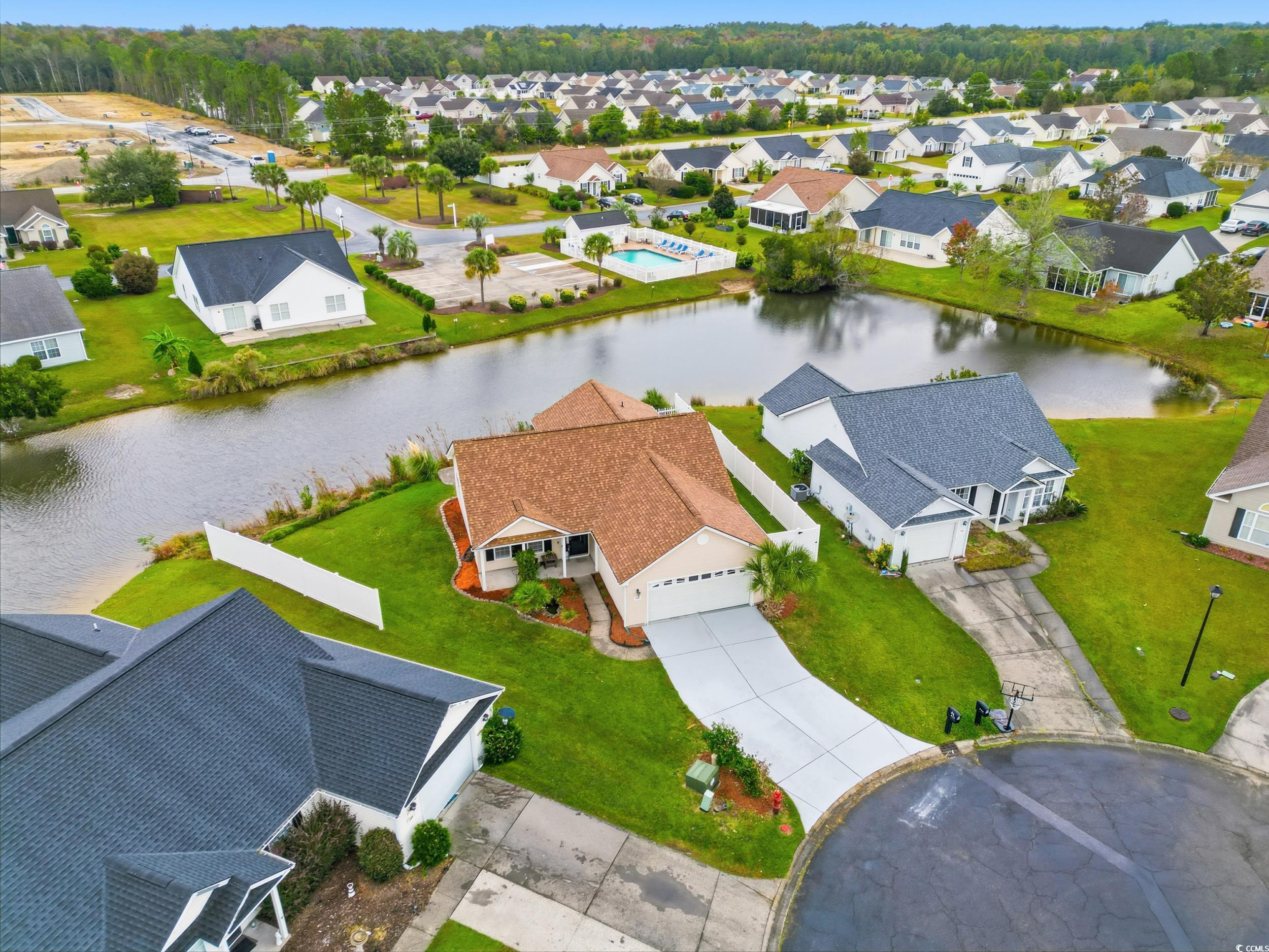 Aerial view of residential area with a large body of water