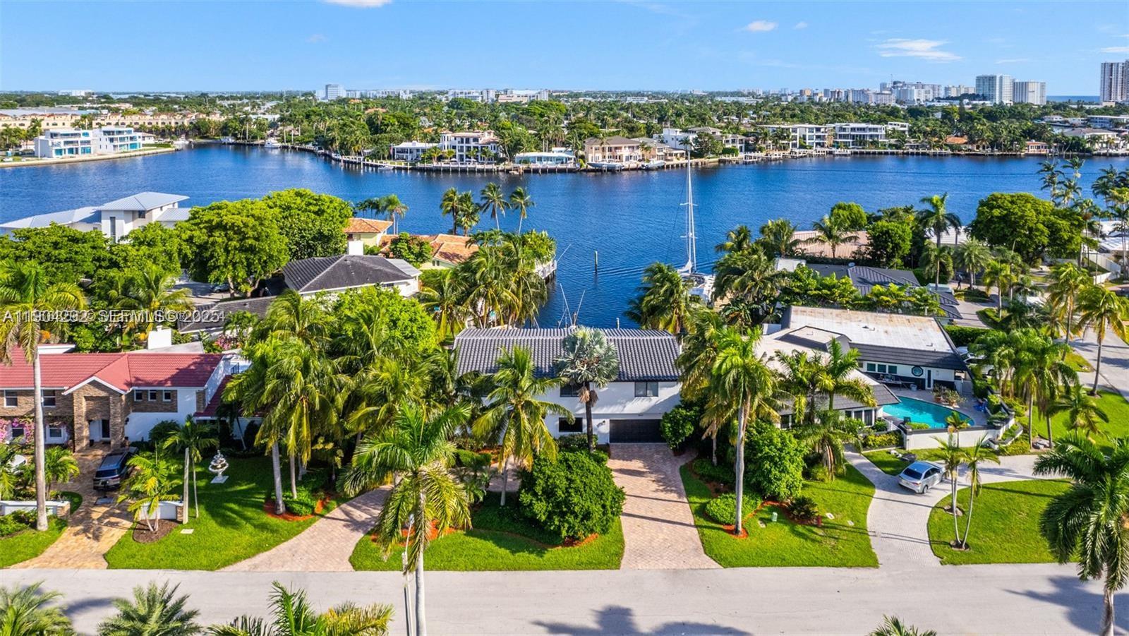 This Rare Waterfront Gem includes 6 LARGE BEDROOMS and 4 Full Baths totaling over 4,400 sq ft. with direct intracoastal and ocean access!! It even includes an additional 7th room which would be perfect for an office. Beautifully remodeled with a Brand new roof, newly renovated pool, impact windows, new paint, new floors, new landscaping, an outdoor kitchen, and the list goes on! A giant backyard which is perfect for entertaining and beautiful views from nearly every room of the house! Just in case of a storm you have a whole home generator which can be powered for weeks! Over 50 feet of water frontage and an extended finger shaped dock giving you direct and easy dockage. Making this is a Boaters Paradise!