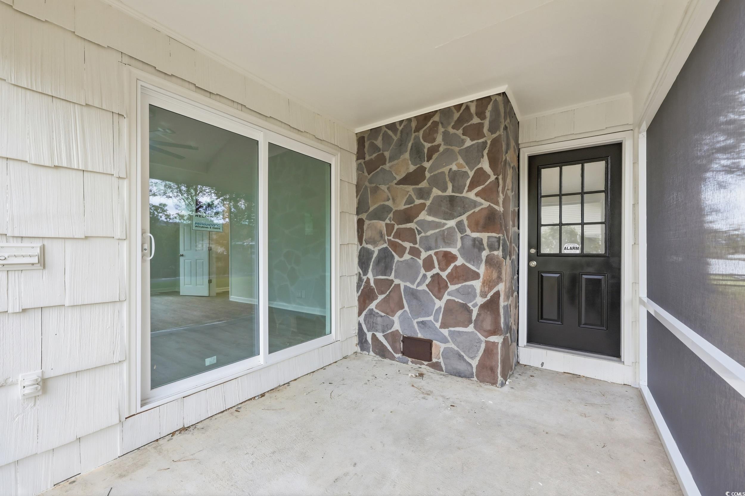 View of exterior entry with stone siding