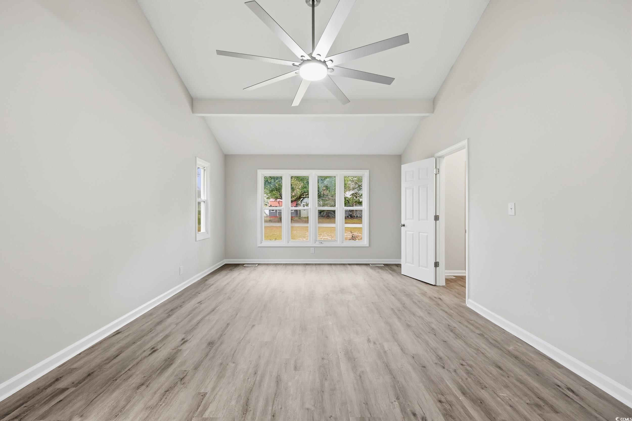 Spare room featuring light wood-style floors and ceiling fan